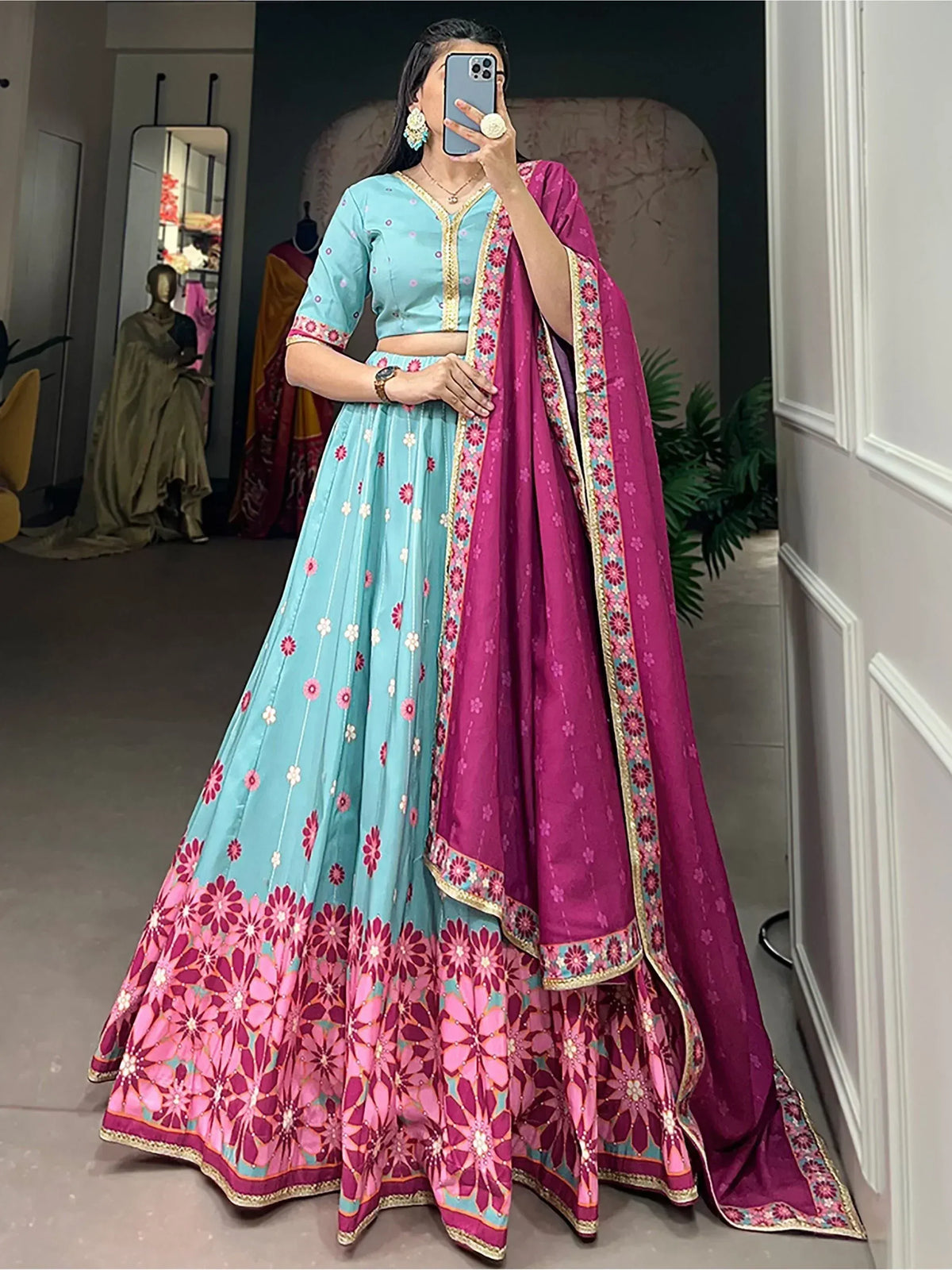 Turquoise and magenta floral lehenga choli with matching dupatta, perfect for Indian ethnic wear