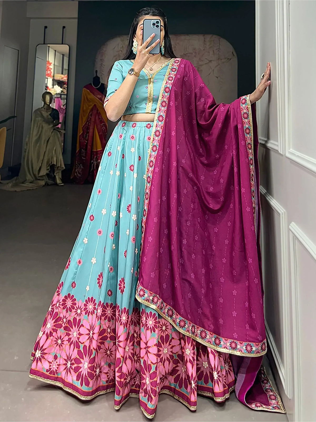 Turquoise and magenta floral lehenga choli with embroidered dupatta, perfect for Indian ethnic occasions