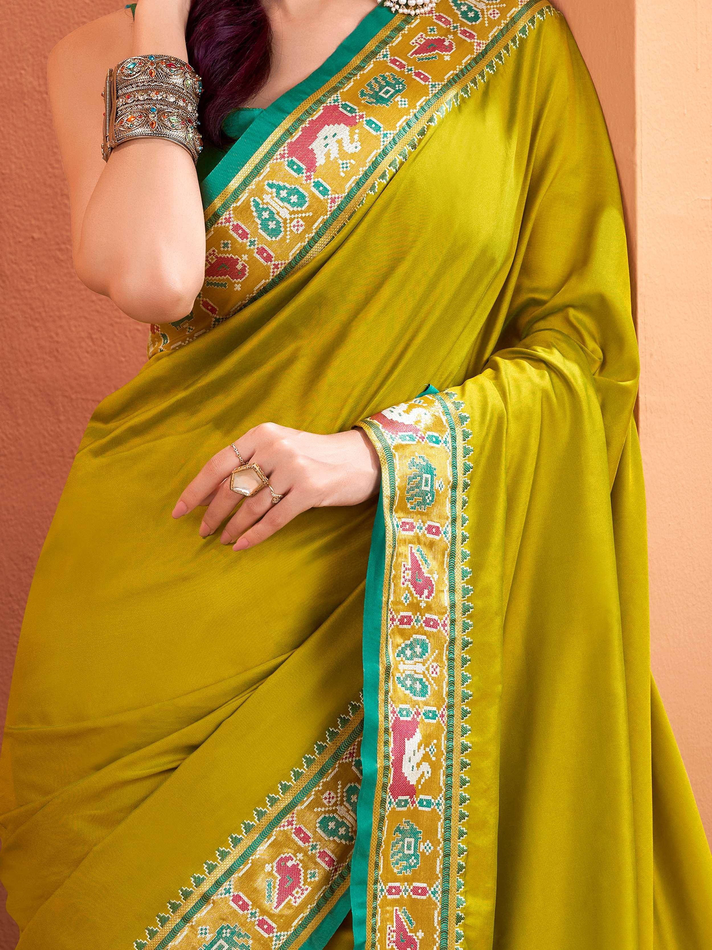 Olive green saree with colorful elephant border, ethnic Indian wear for women