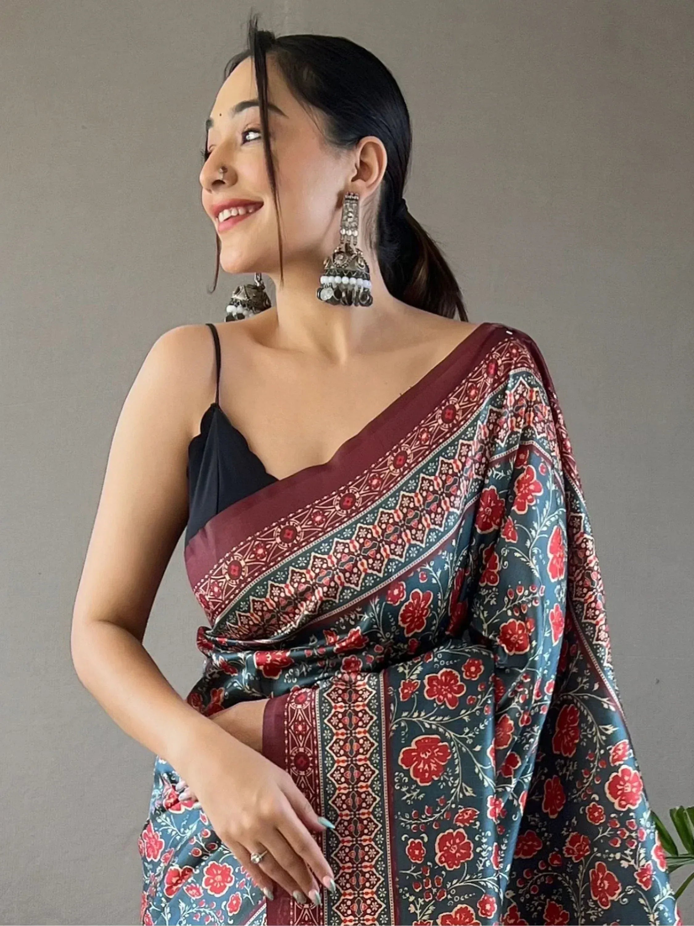 Woman in floral print saree with maroon border, ethnic wear, traditional Indian fashion