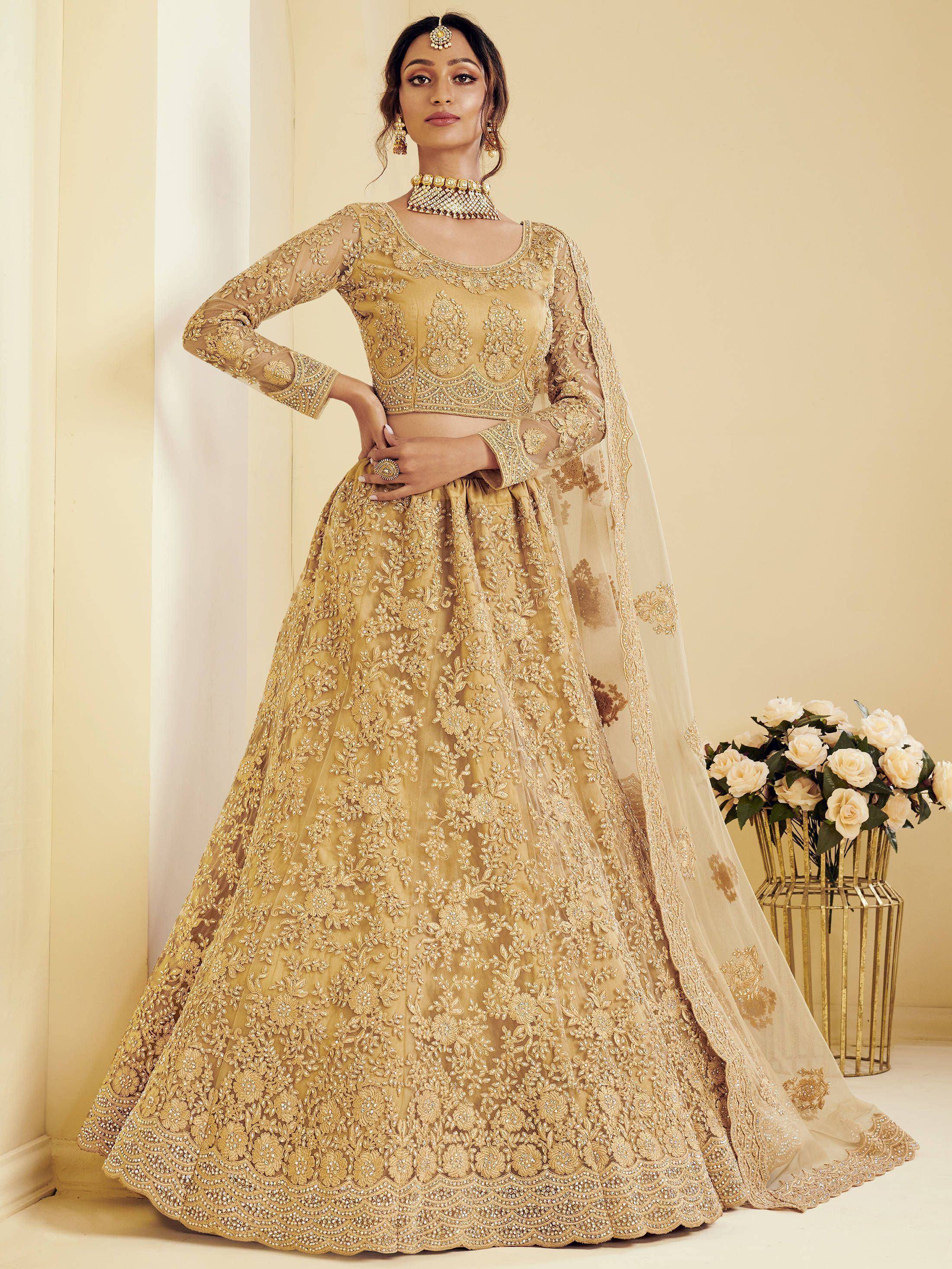 Gold embroidered lehenga choli with sheer dupatta, perfect for Indian weddings and festive occasions
