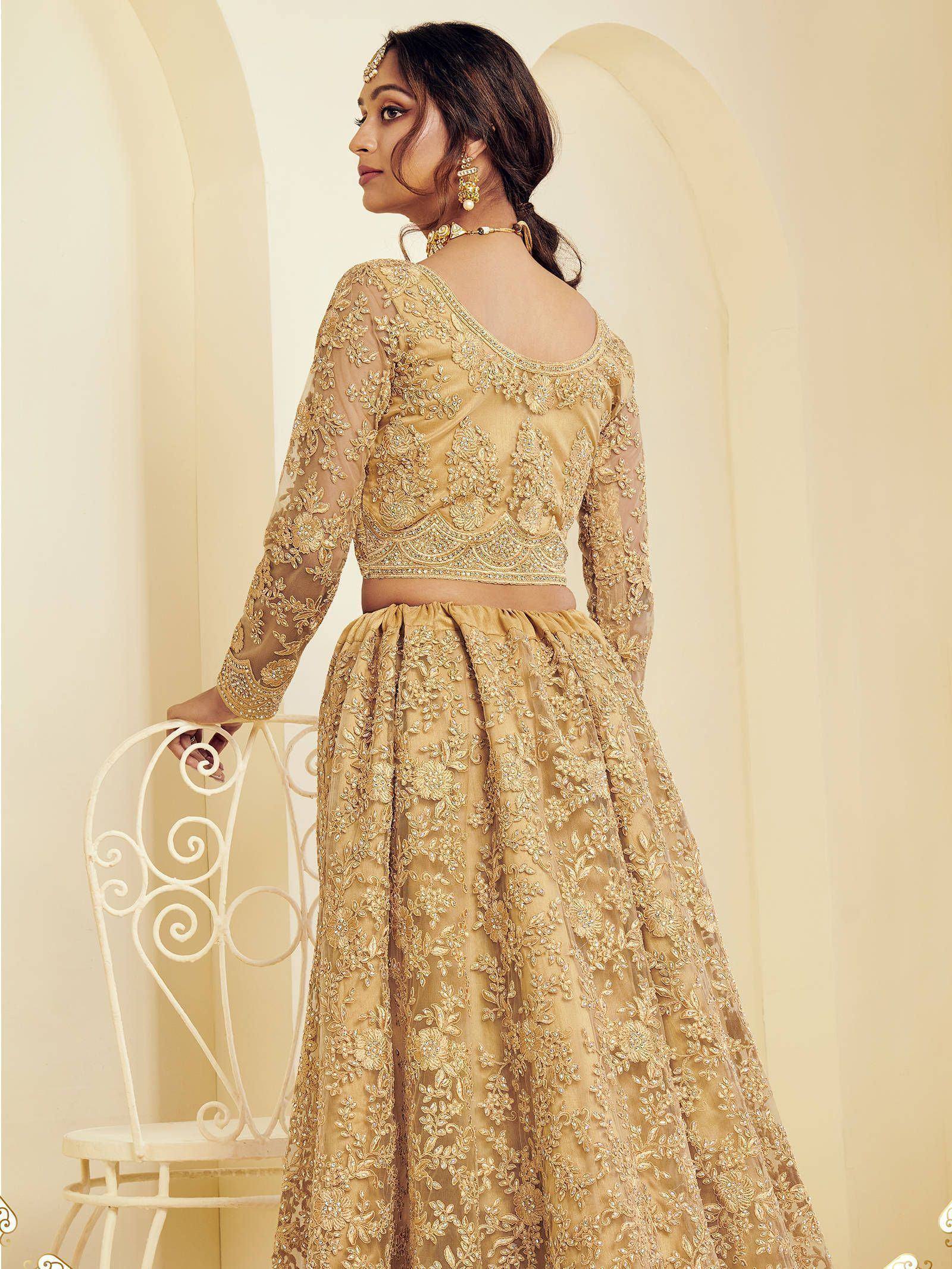 Gold embroidered lehenga choli with sheer long sleeves, perfect for Indian weddings and festive occasions.