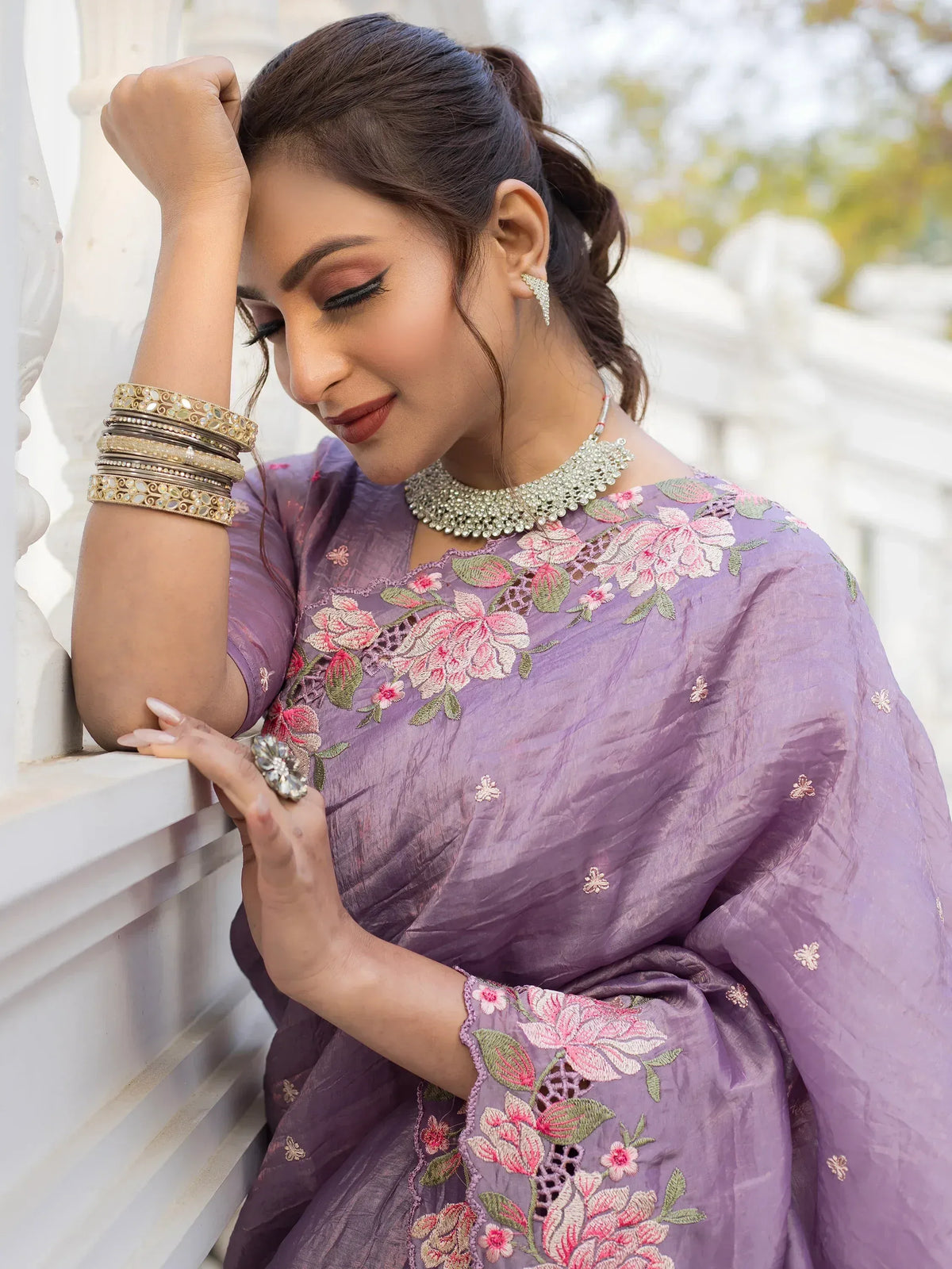 Purple floral embroidered Indian ethnic gown with traditional jewelry for women