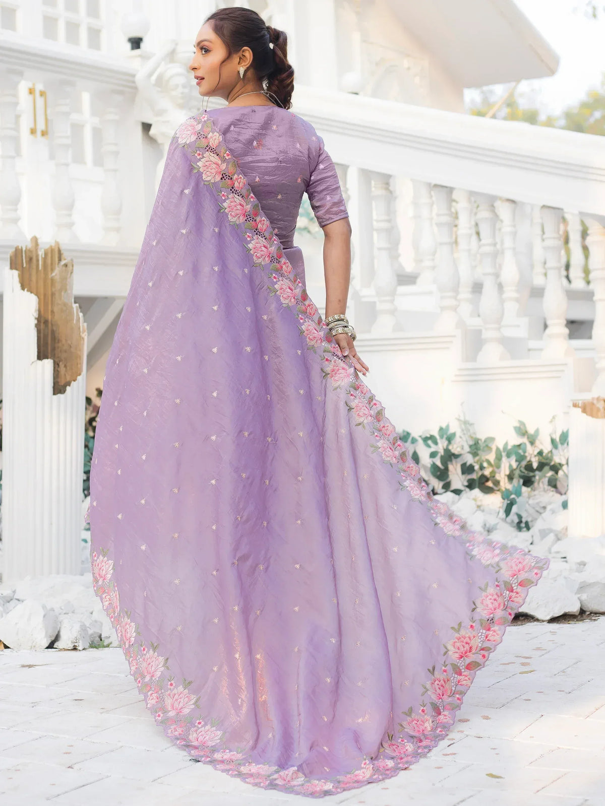 Lavender ethnic gown with floral embroidery, perfect for Indian occasions and festive wear.
