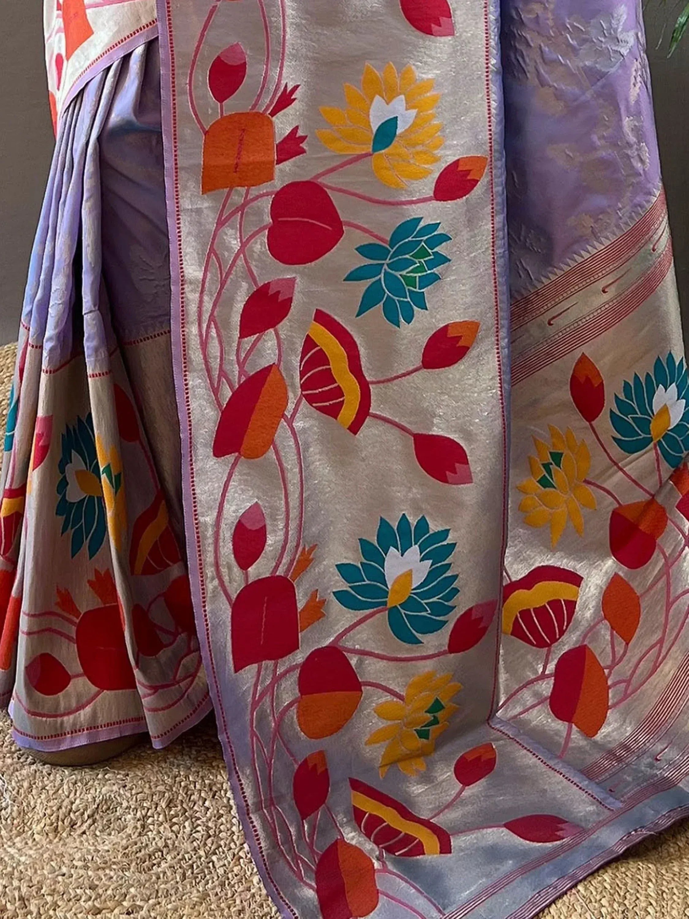 Vibrant floral print saree with colorful lotus motifs, perfect for Indian ethnic wear occasions.