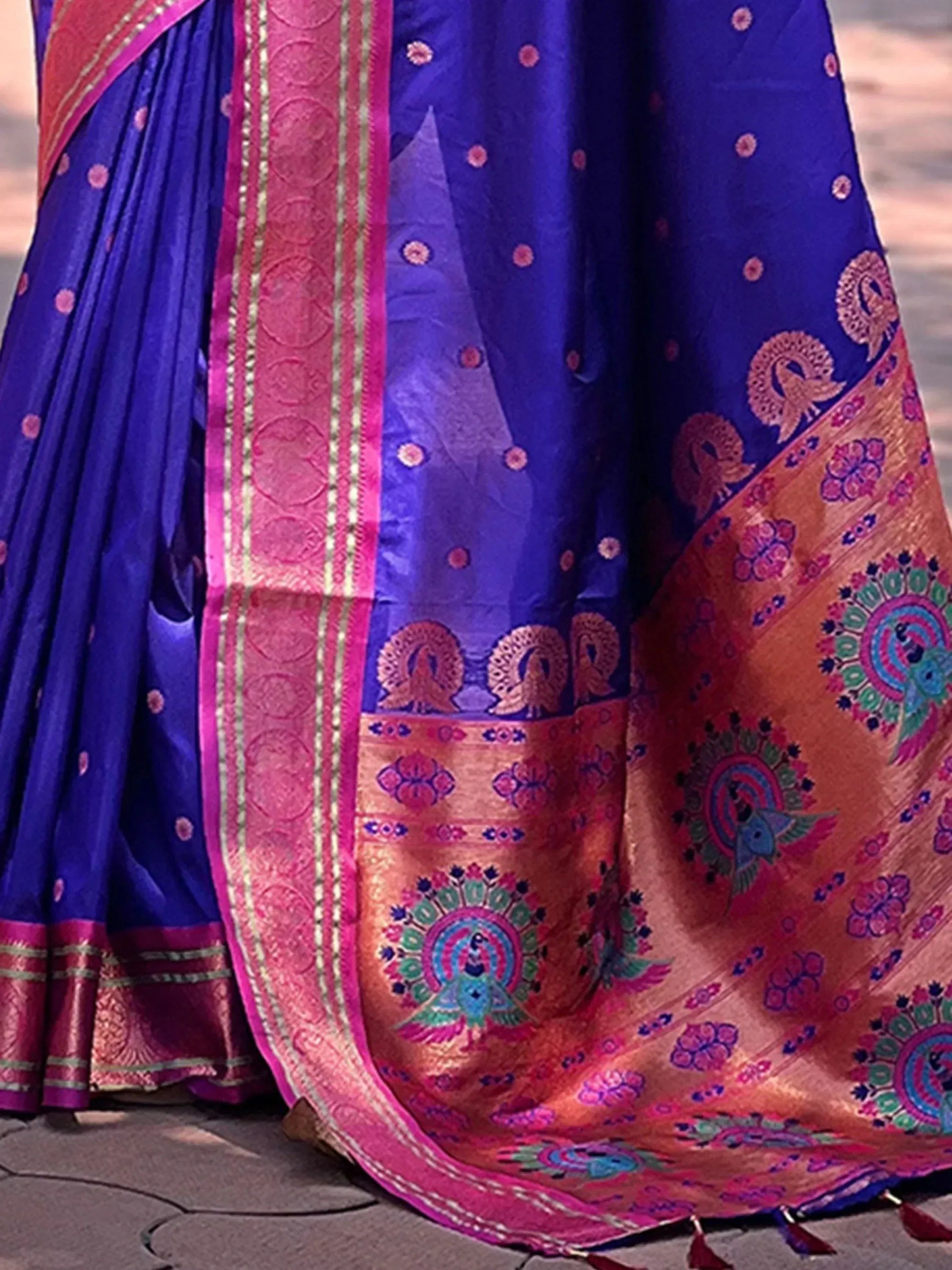 Royal blue saree with pink peacock motifs and gold border, traditional Indian ethnic wear