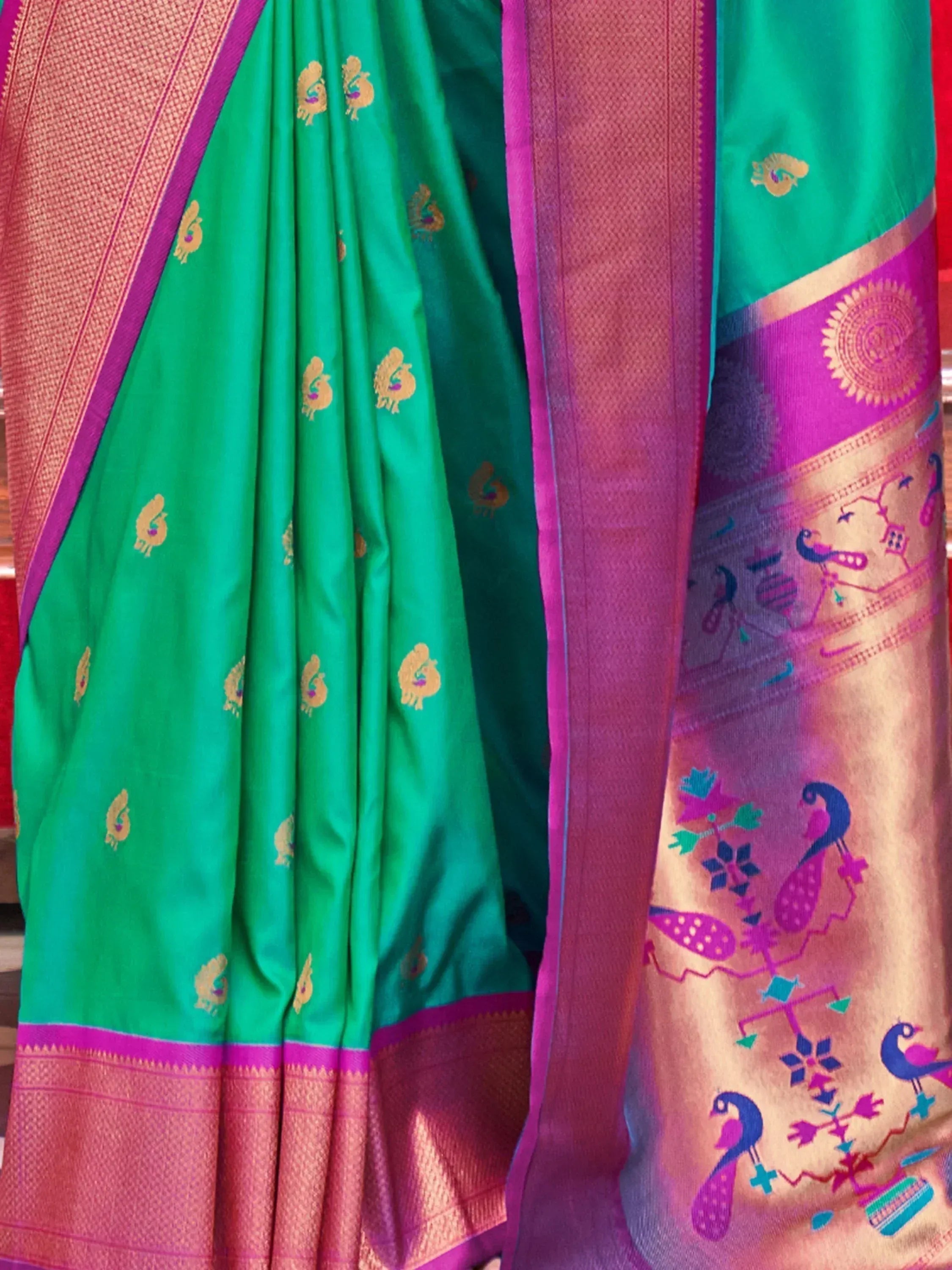Green and pink silk saree with peacock motifs and woven border, Indian ethnic wear