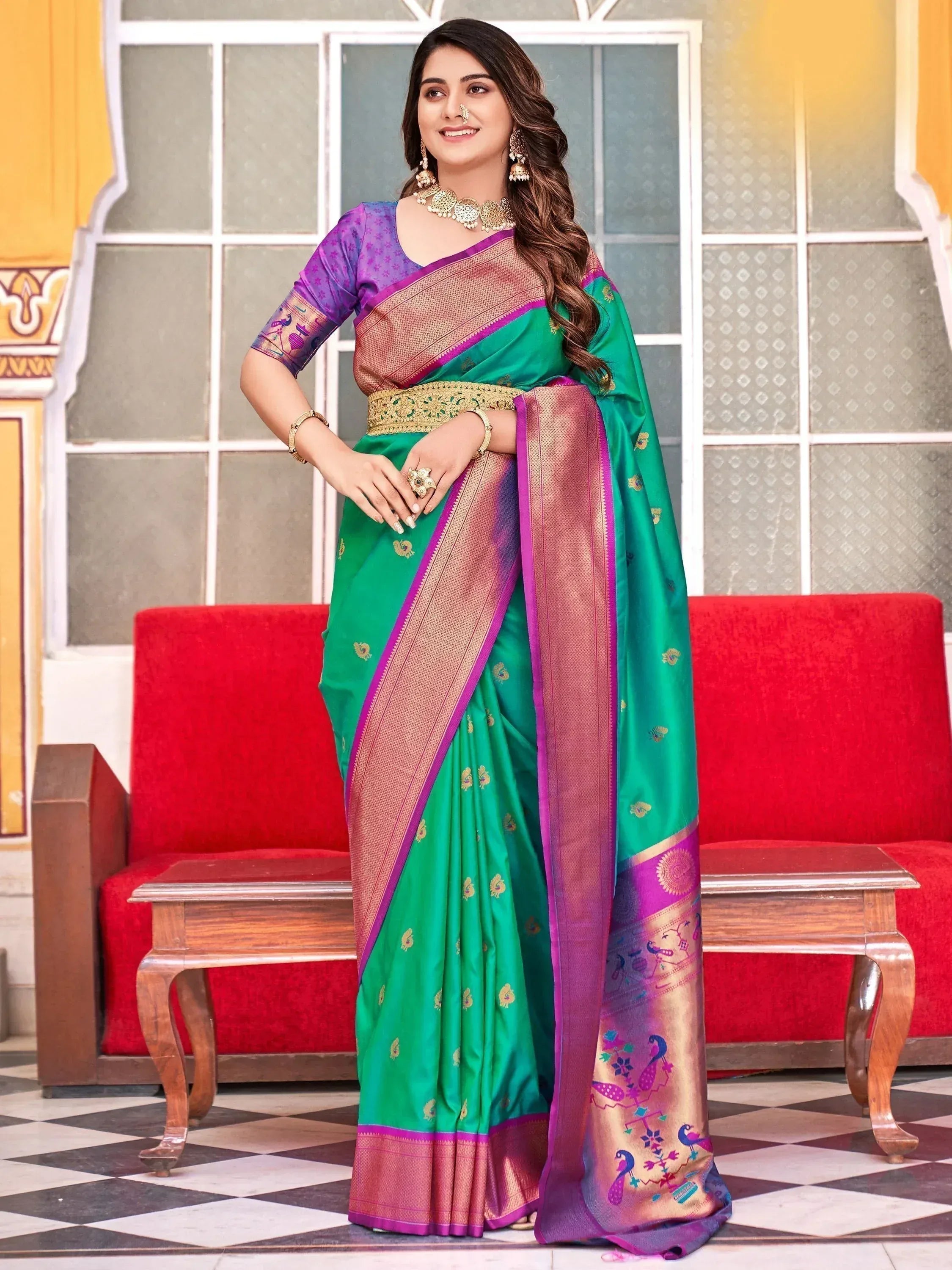 Green and purple designer saree with peacock motifs, gold border, and matching blouse for Indian ethnic wear