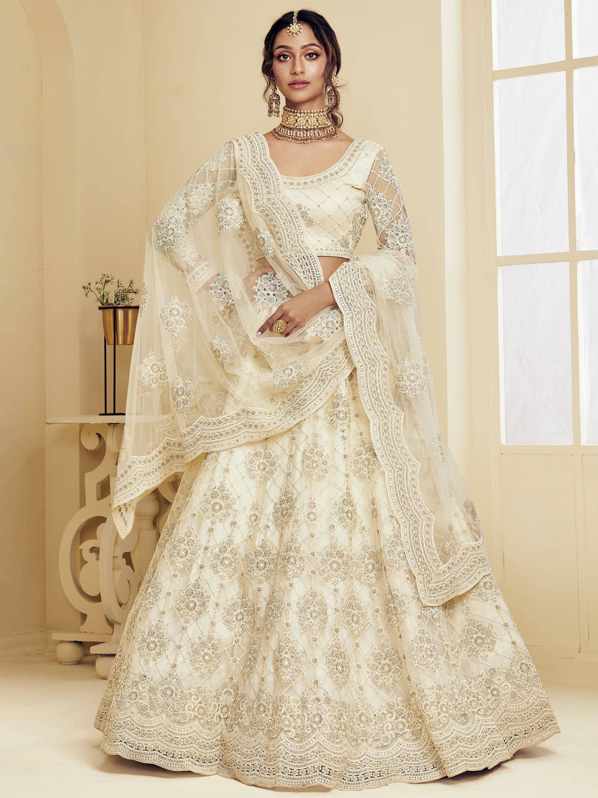 Elegant ivory designer lehenga choli with heavy embroidery and net dupatta for weddings