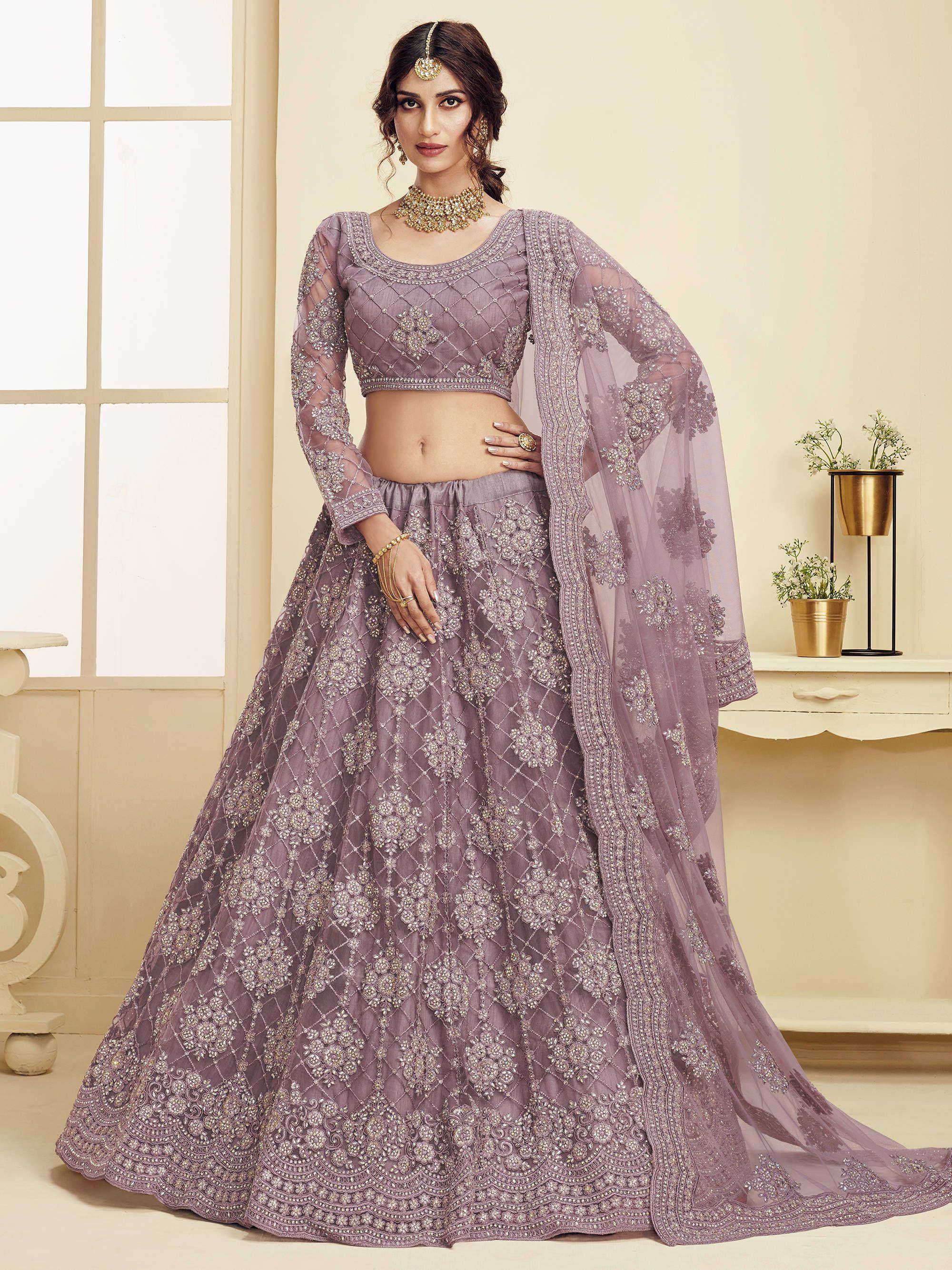 Lavender designer lehenga choli with heavy embroidery and sheer dupatta, perfect for Indian weddings and festive occasions.
