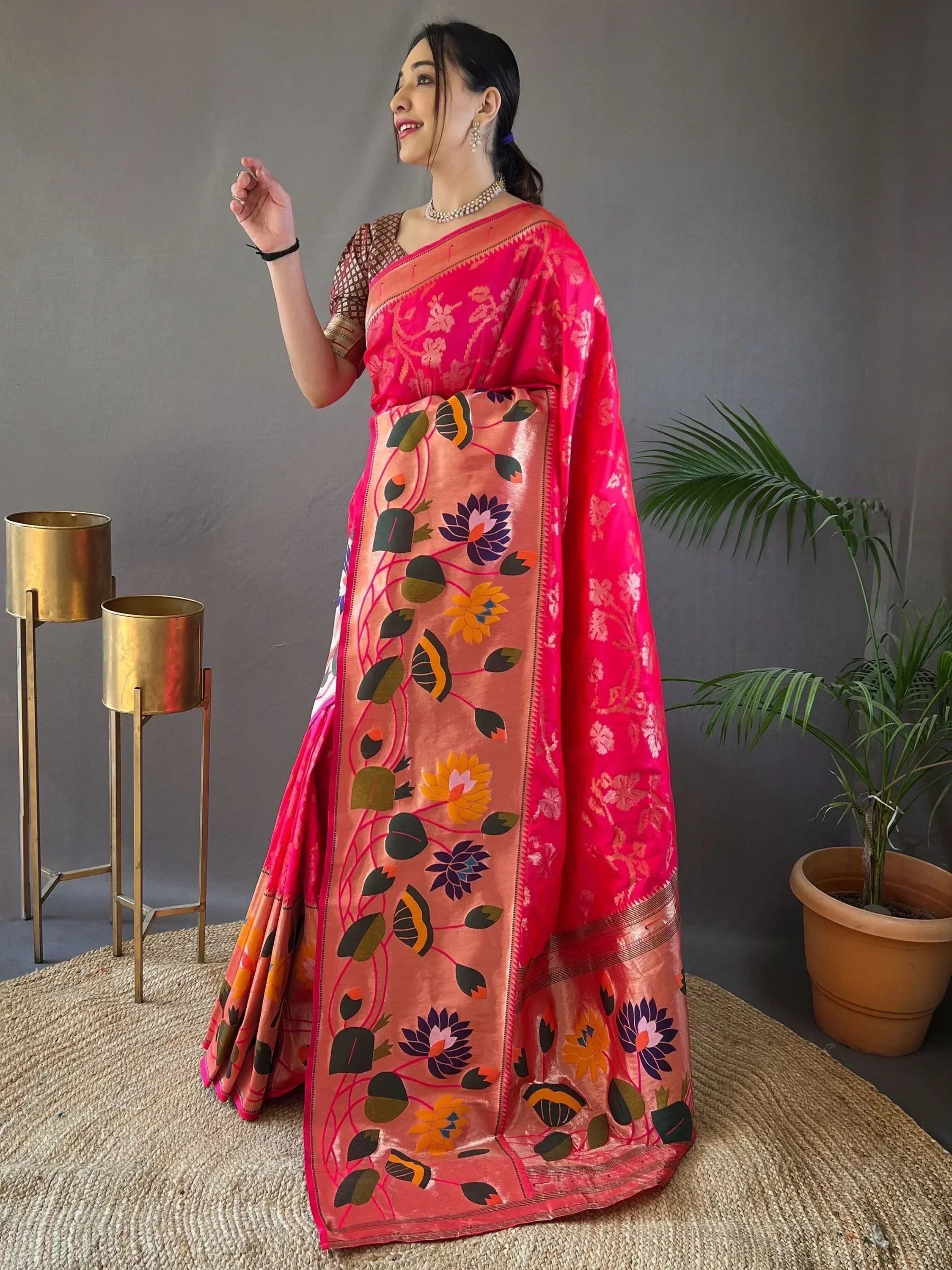 Vibrant pink floral saree with embroidered border, perfect for Indian ethnic wear occasions