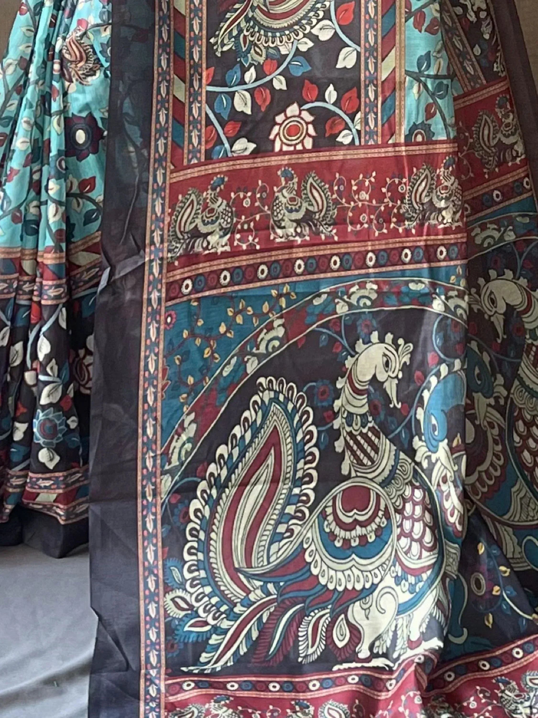 Indian ethnic lehenga with peacock and floral print in blue, red, and black