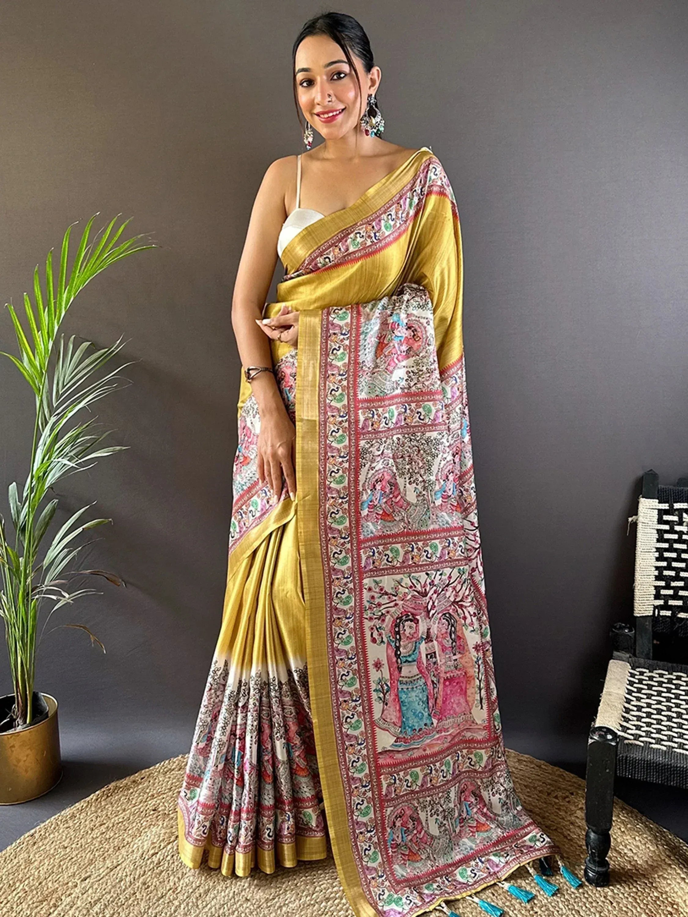 Yellow and multicolor printed saree with intricate folk art design, perfect for ethnic occasions