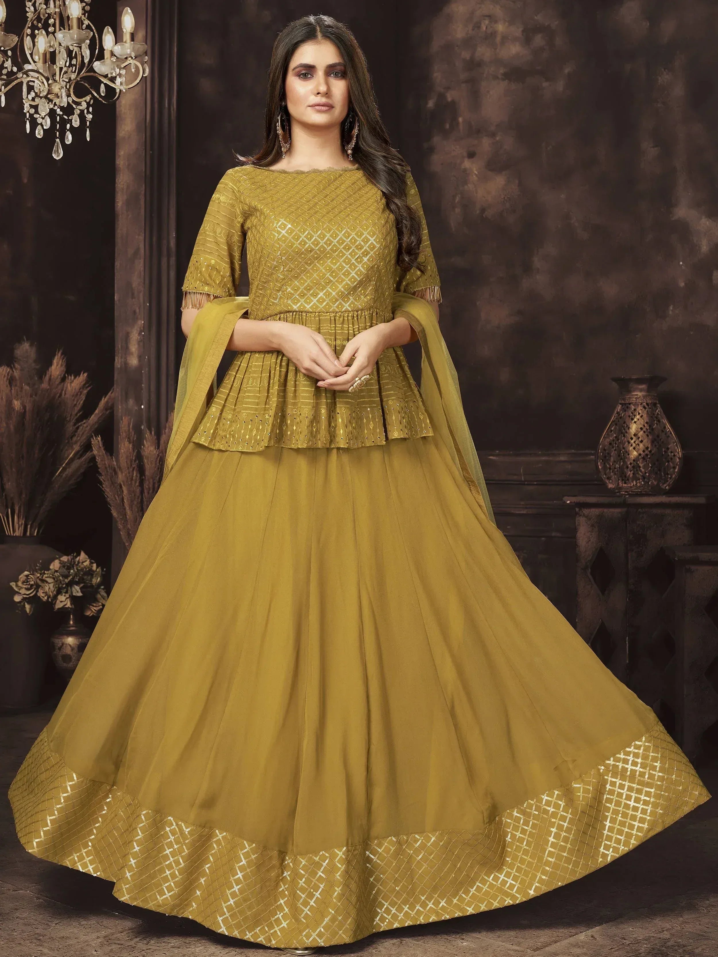 Mustard yellow ethnic lehenga choli with gold embroidery and peplum top, perfect for Indian weddings and festive occasions