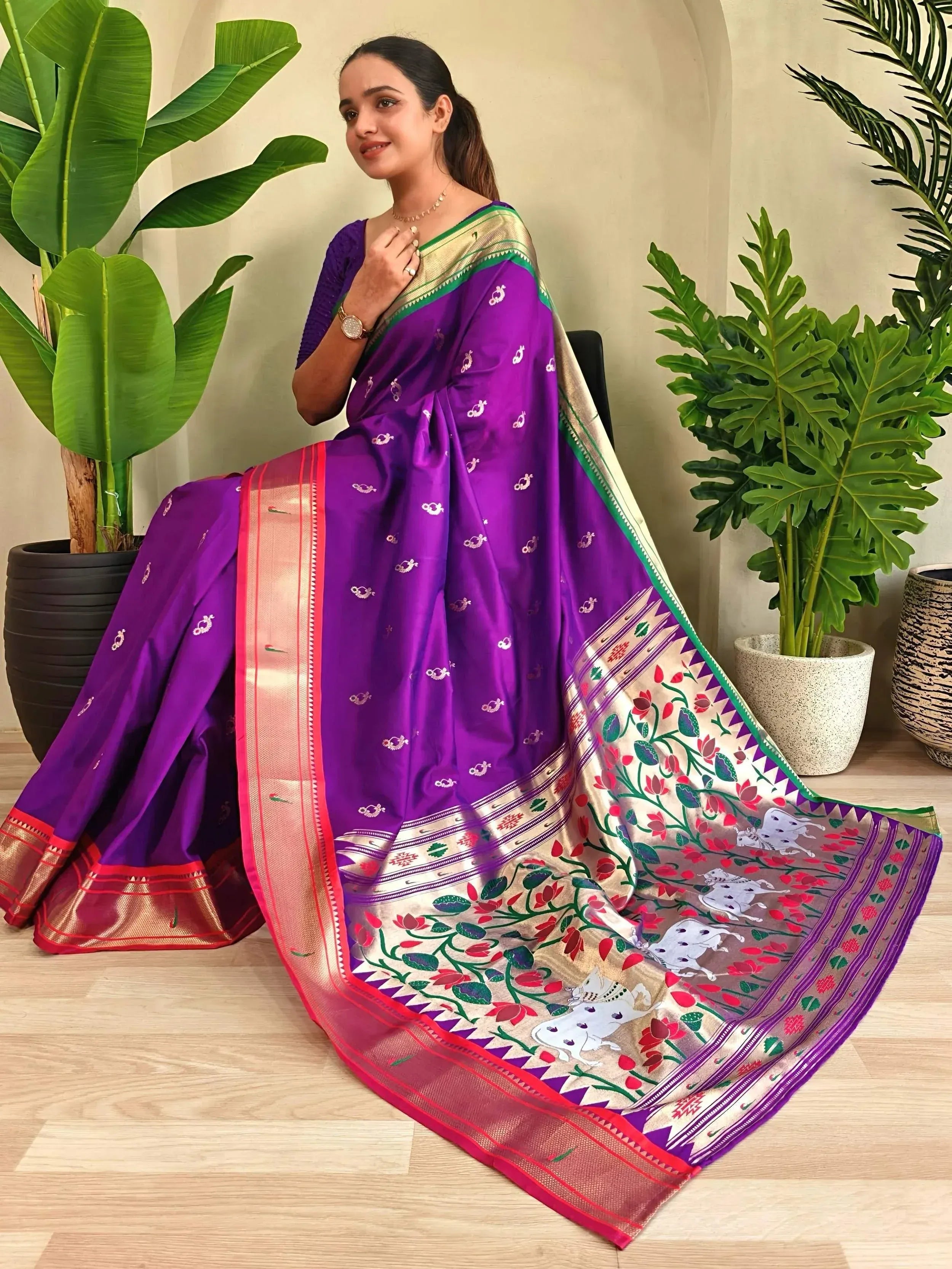 Purple silk saree with floral and cow motifs, gold border, perfect for Indian ethnic wear occasions