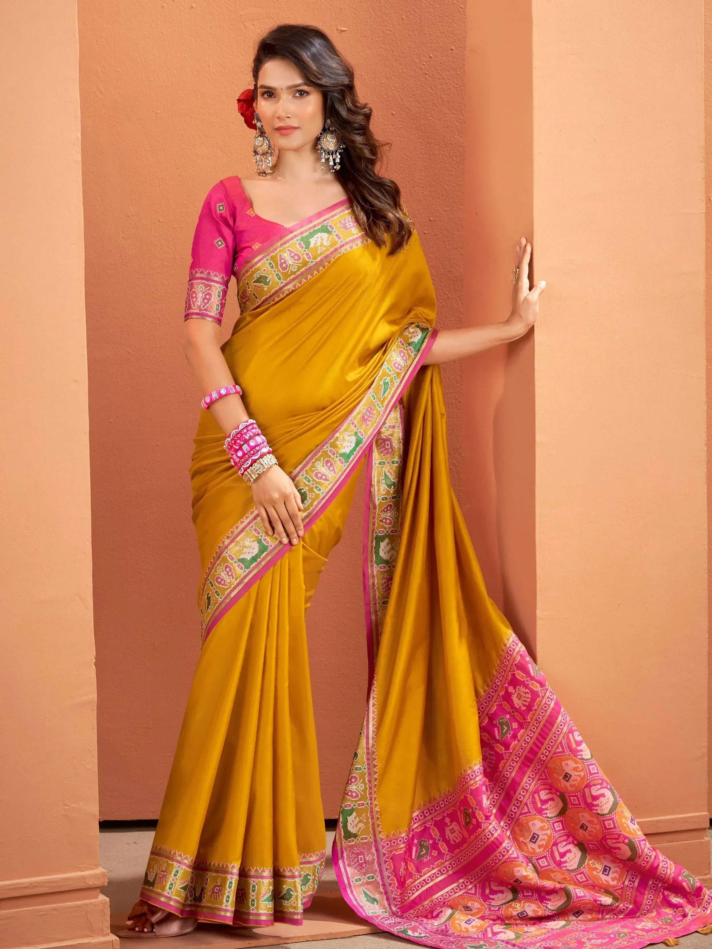 Mustard yellow saree with pink blouse and elephant print border, Indian ethnic wear