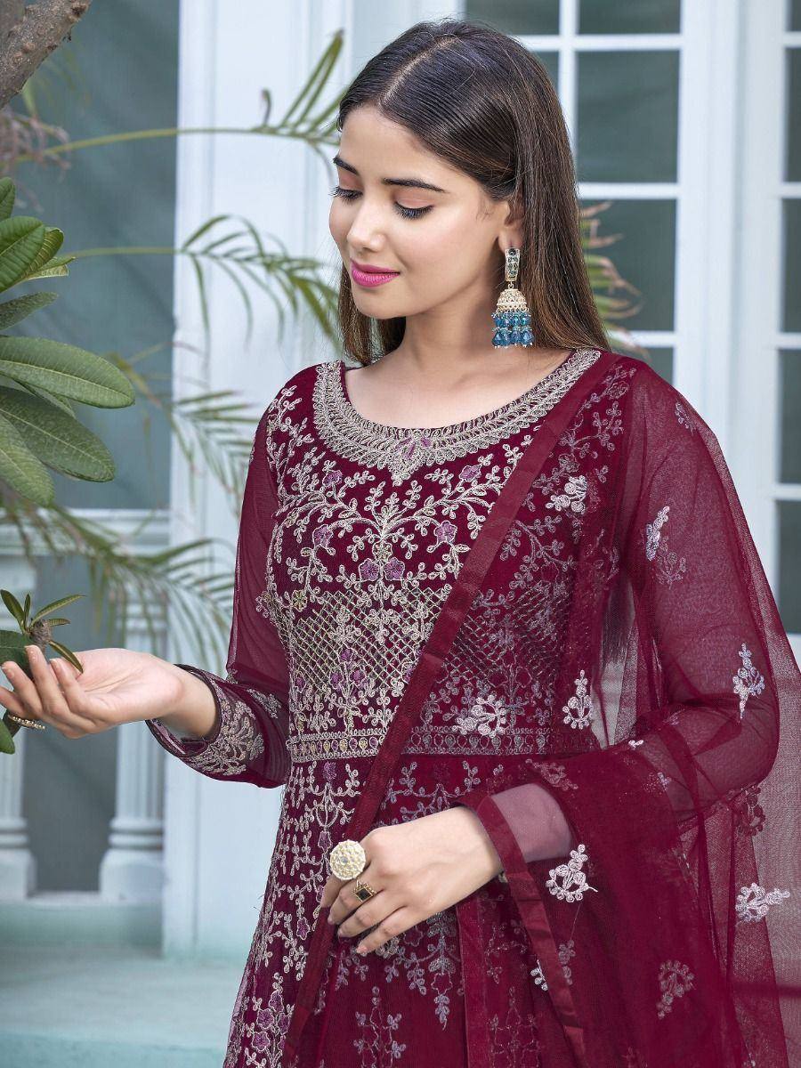 Maroon embroidered ethnic gown with sheer sleeves and floral detailing, perfect for Indian occasions