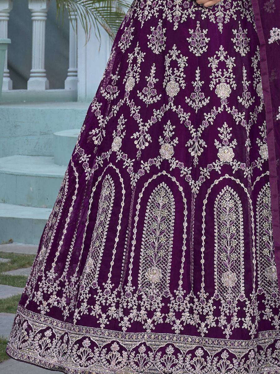 Purple velvet lehenga with intricate silver embroidery and floral motifs, perfect for Indian ethnic wear occasions.