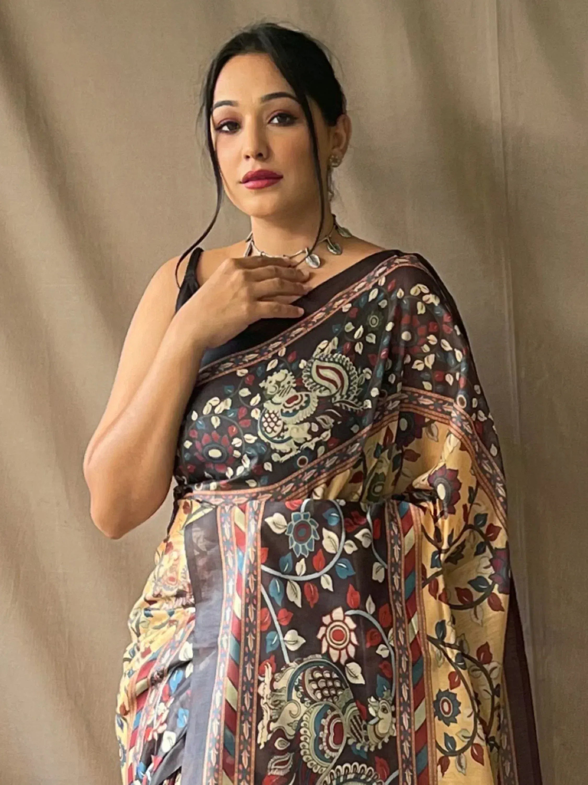 Woman in floral printed ethnic saree with paisley design, perfect for Indian occasions