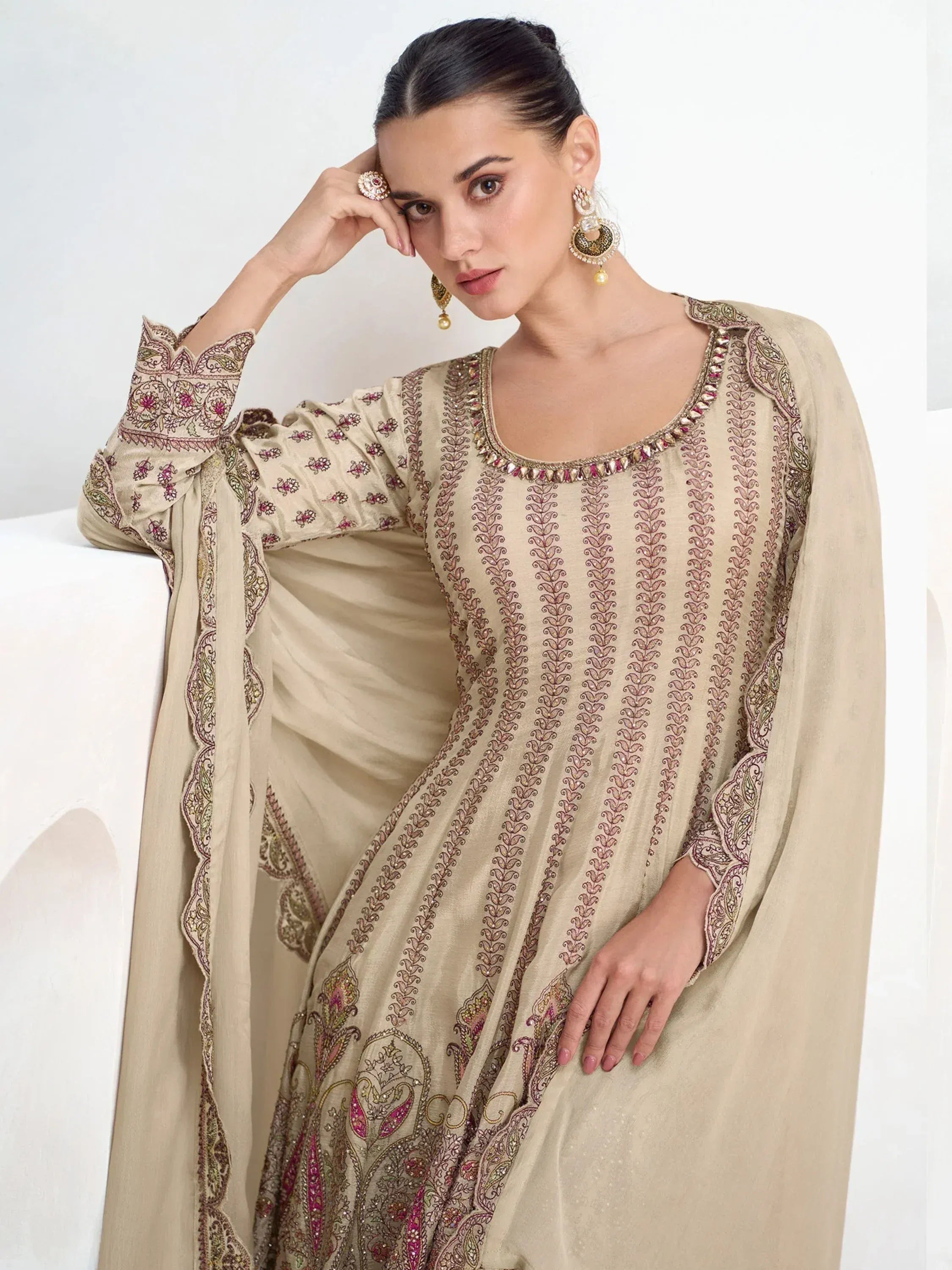 Beige embroidered salwar kameez with floral detailing, perfect for Indian ethnic wear occasions.