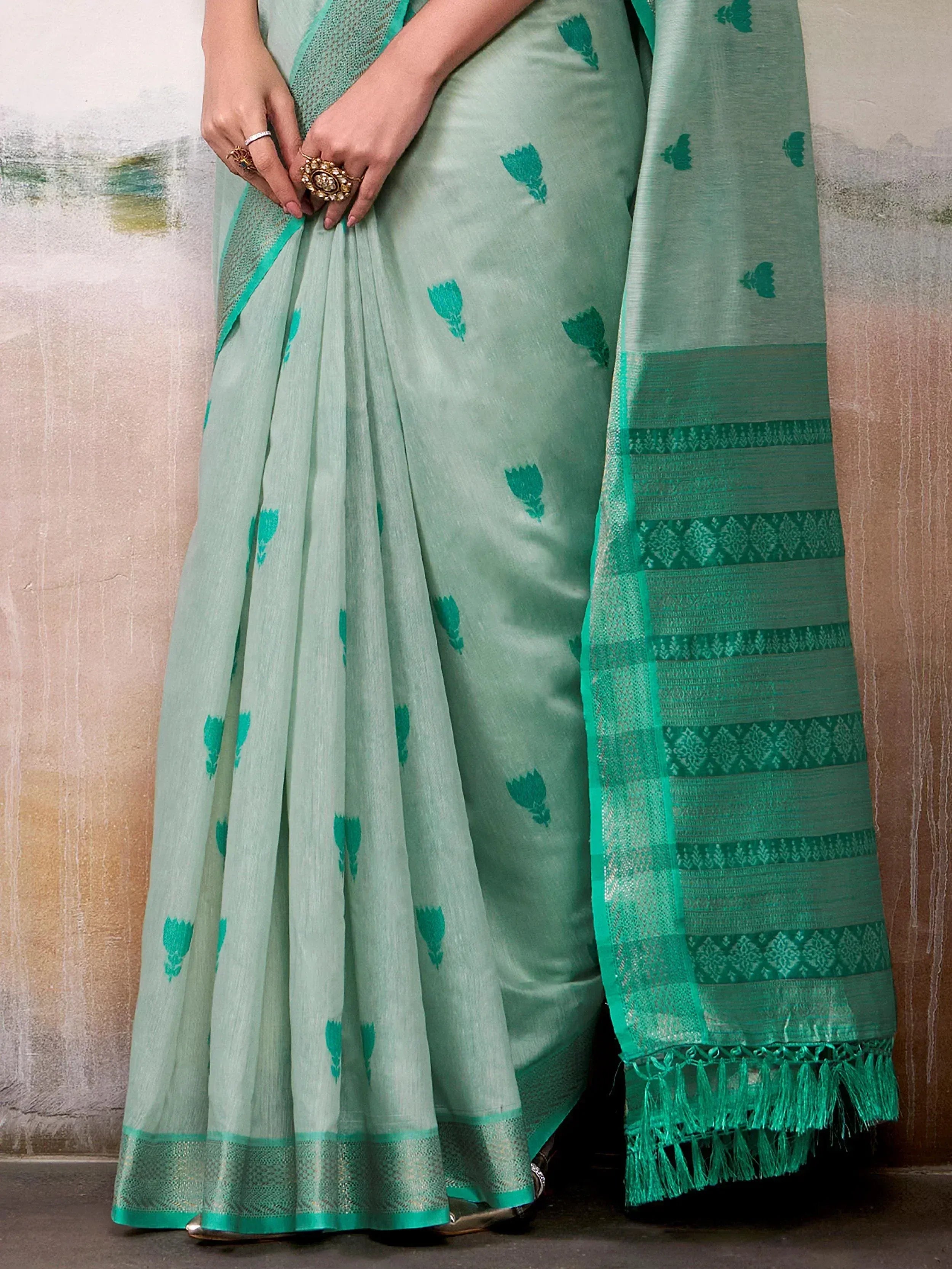 Mint green saree with teal floral prints and woven border, ethnic Indian wear for women