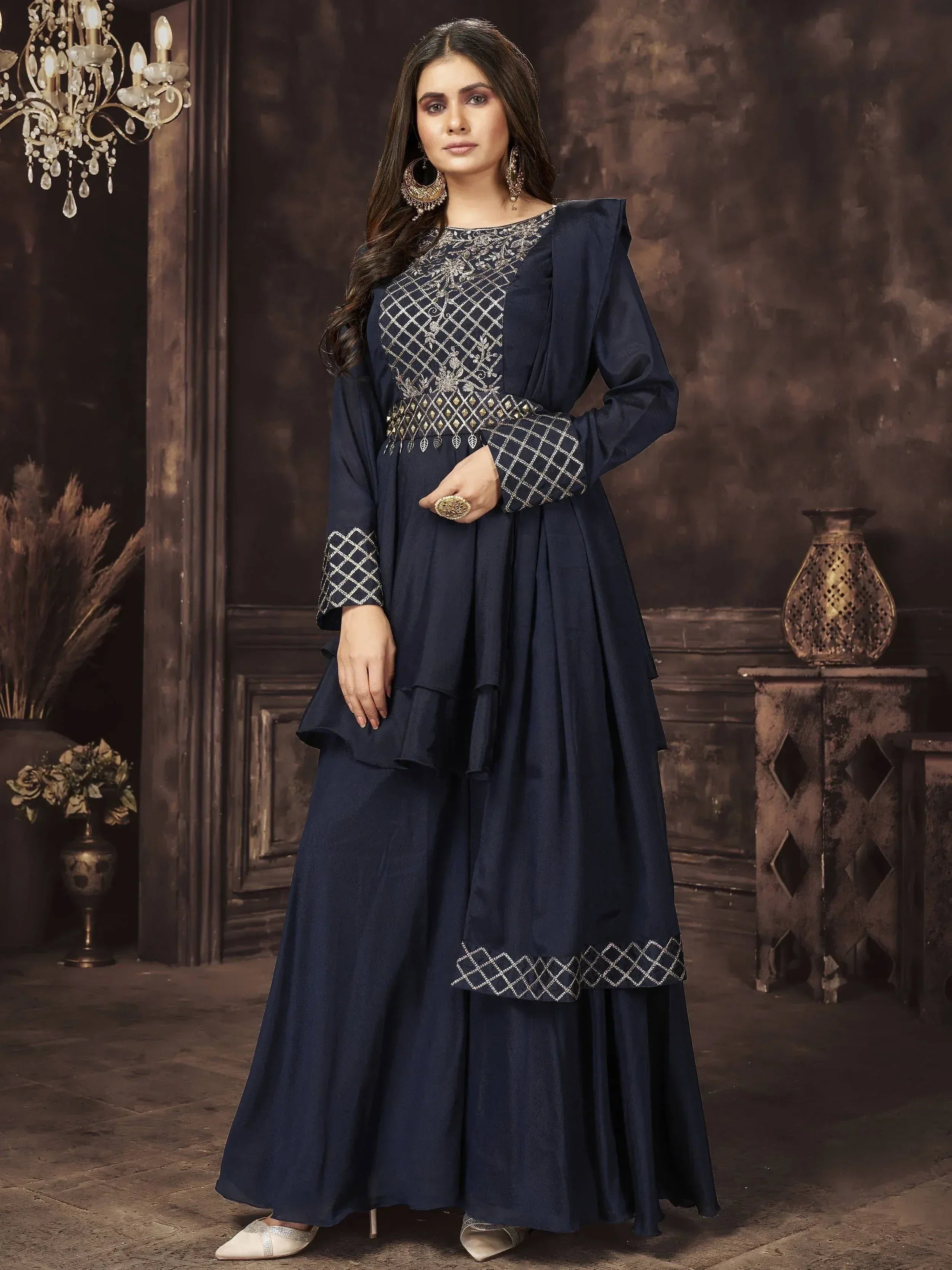 Navy blue embroidered anarkali suit with ruffled layers and gold detailing, perfect for Indian ethnic occasions.