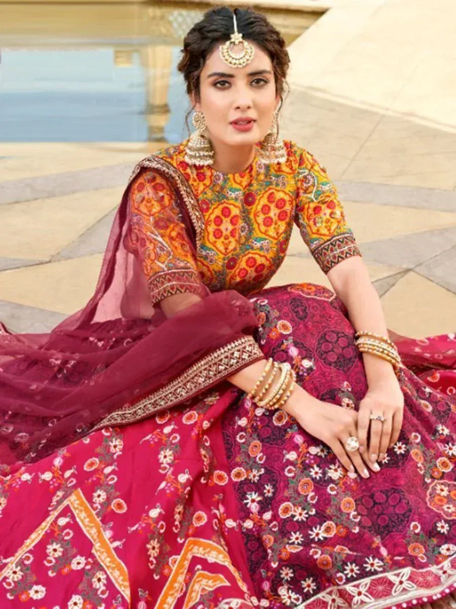 Woman in vibrant ethnic lehenga choli with floral embroidery, traditional jewelry, and dupatta, perfect for Indian celebrations.
