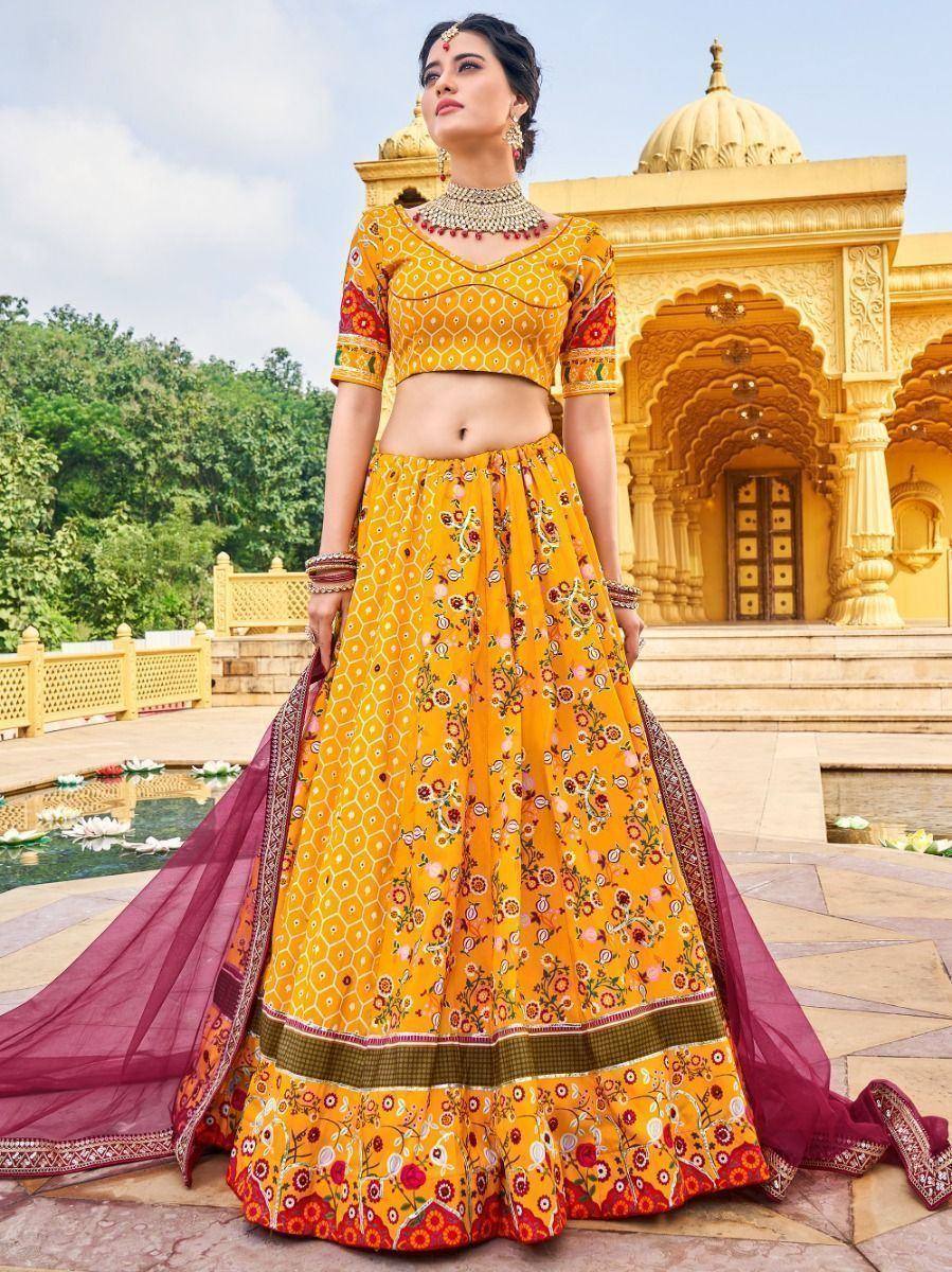 Yellow floral lehenga choli with maroon dupatta, perfect for Indian weddings and festive occasions