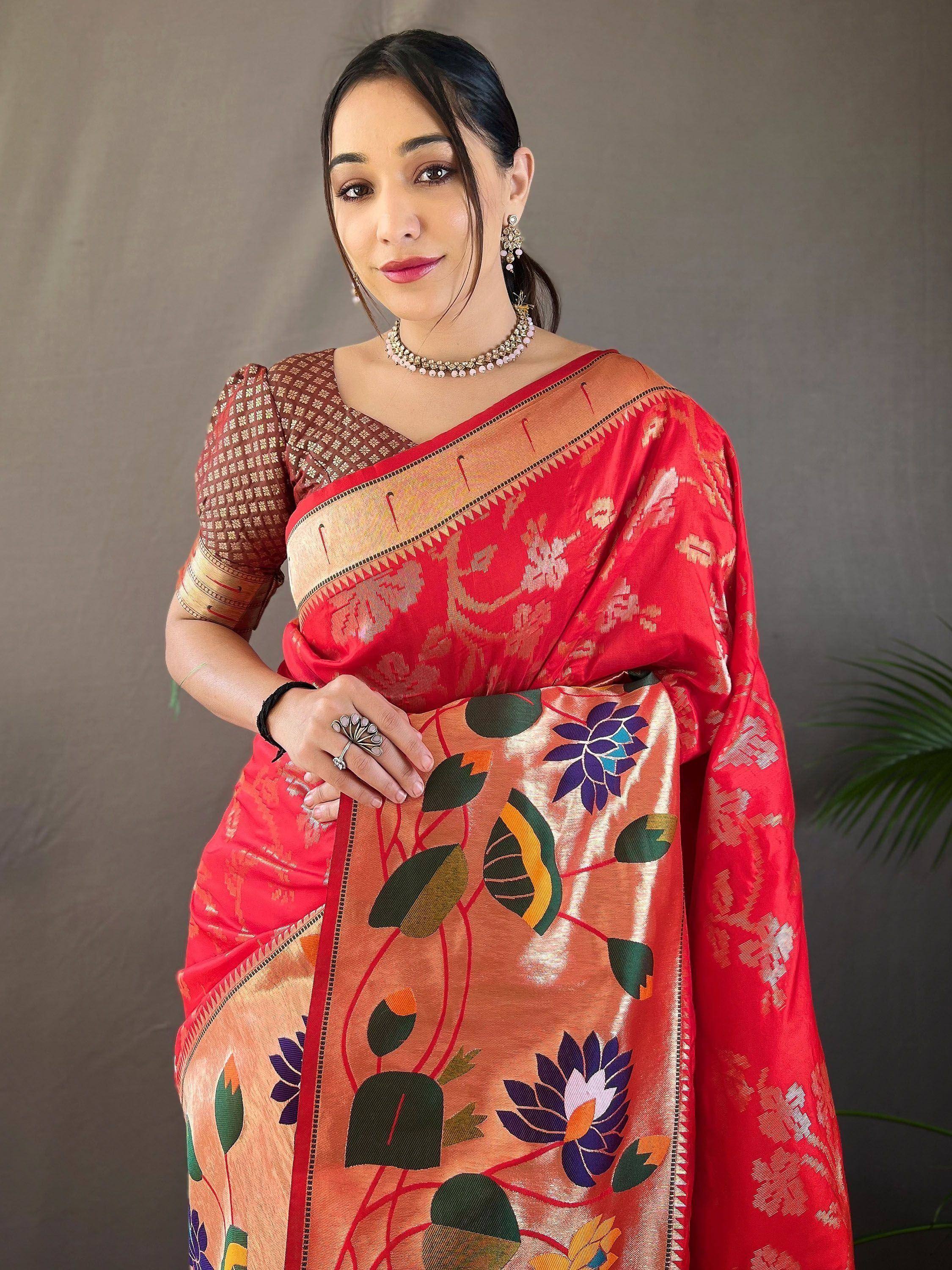Woman in red and gold floral print saree with designer blouse, ethnic Indian wear