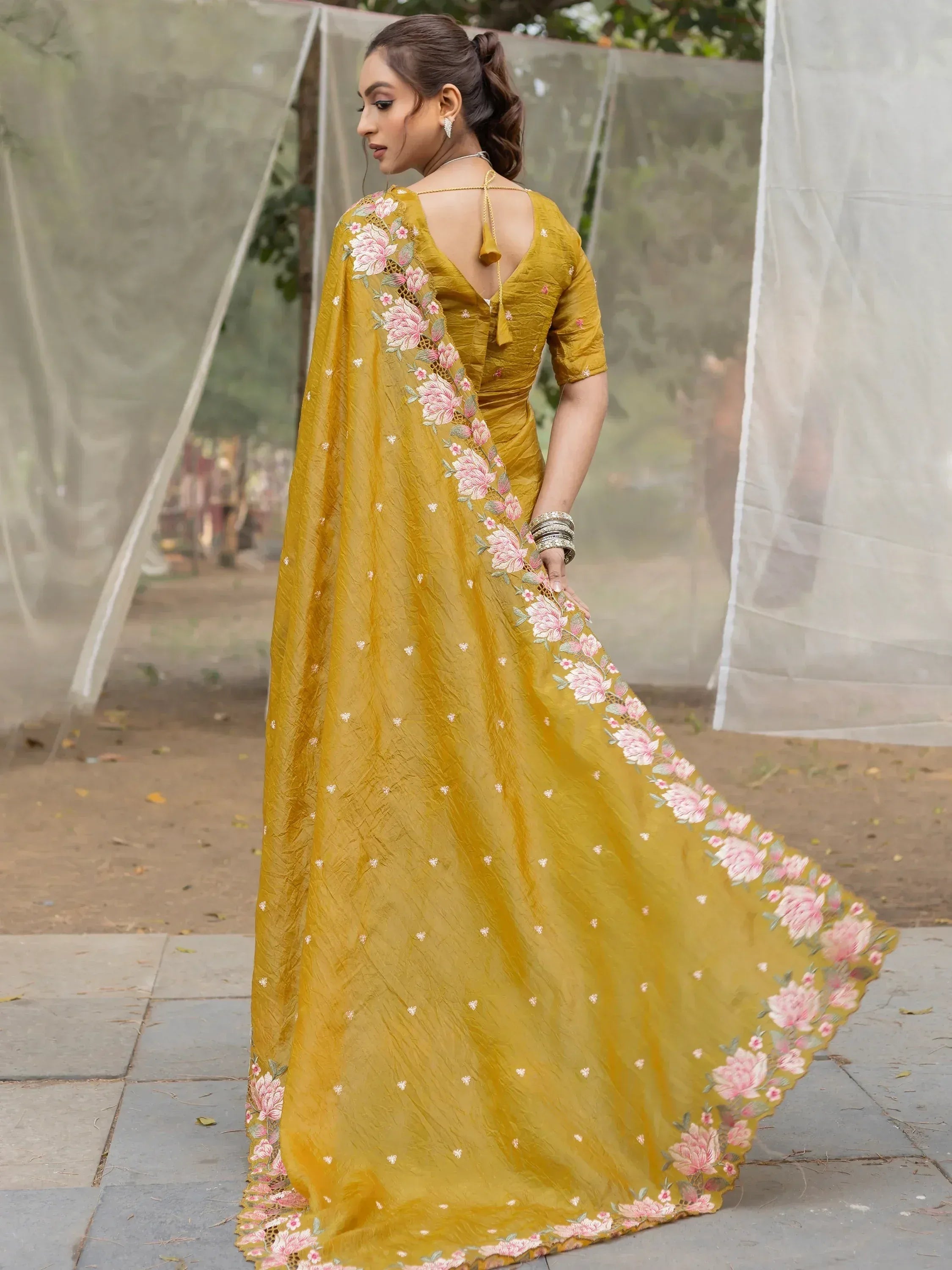 Mustard yellow saree with pink floral embroidery, perfect for Indian ethnic occasions