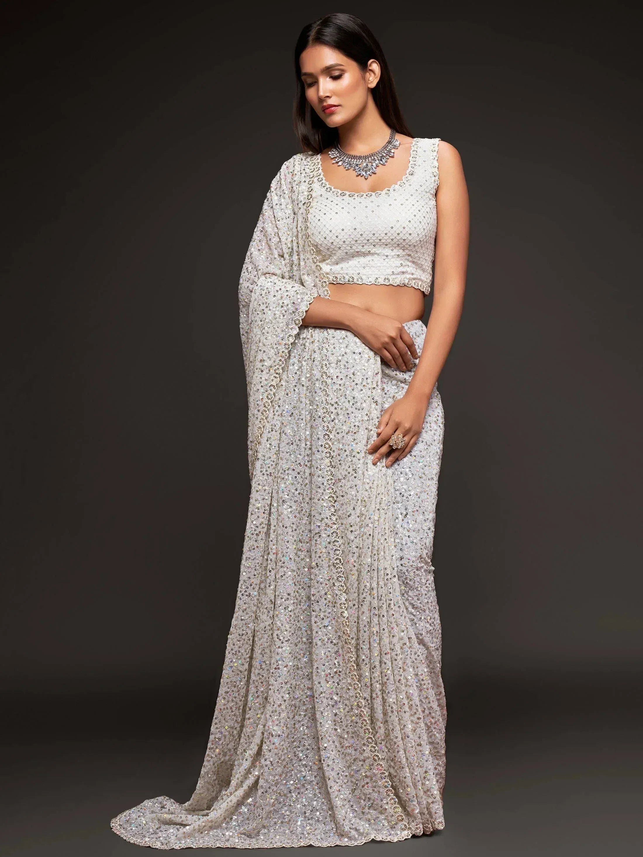 Elegant white sequined lehenga choli with matching dupatta, perfect for Indian ethnic wear occasions
