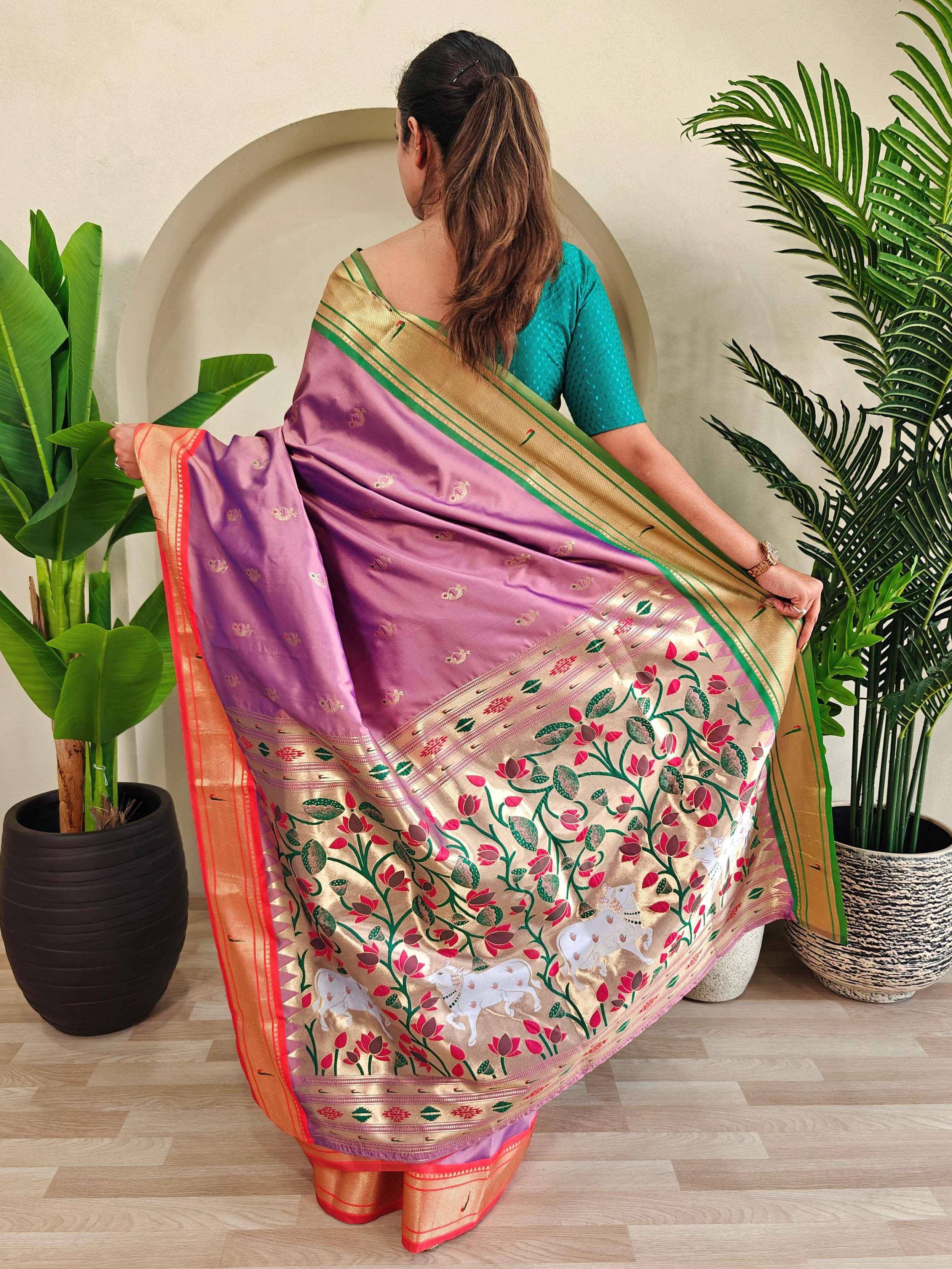 Purple and gold floral saree with temple border, styled with teal blouse for Indian ethnic wear