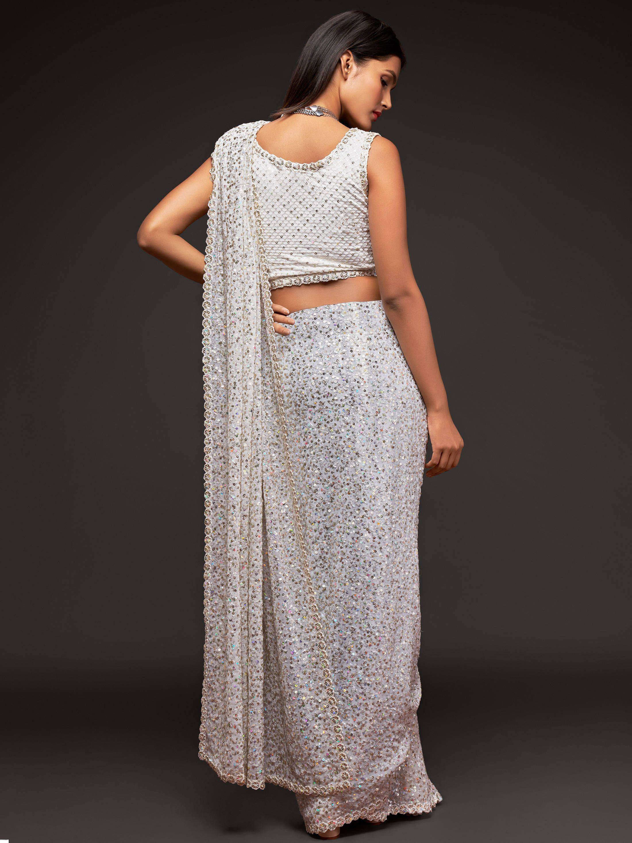 White sequined lehenga choli with backless blouse and dupatta, ethnic Indian wear