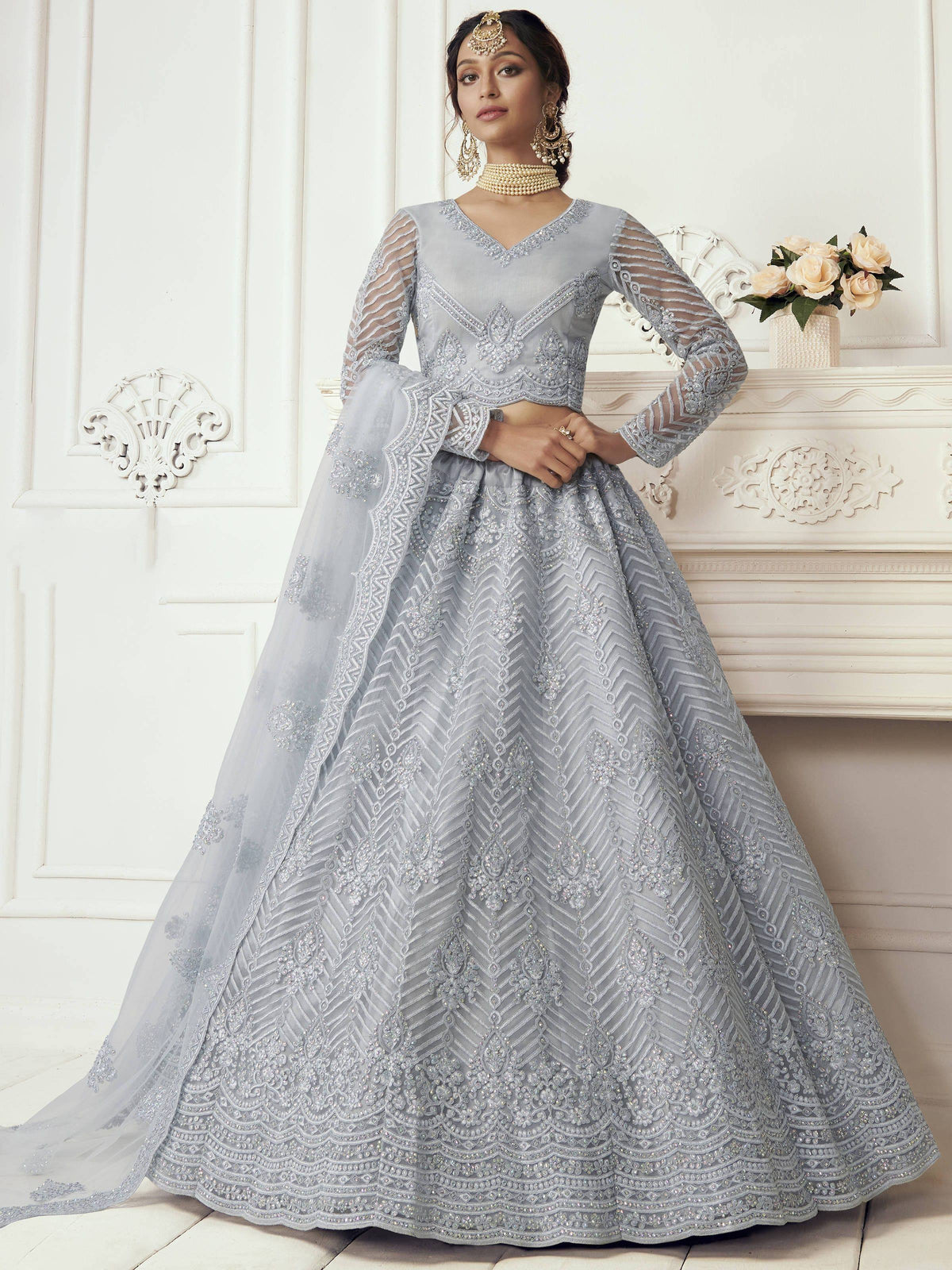Elegant grey lehenga choli with intricate embroidery and sheer sleeves for Indian ethnic wear