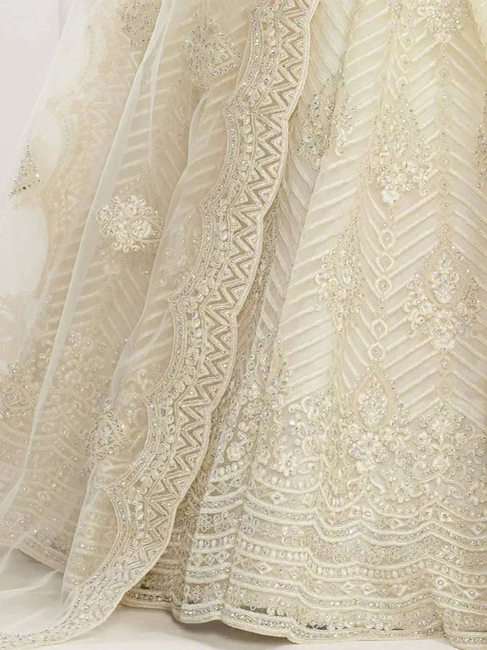 Elegant cream lehenga with intricate embroidery and beadwork for Indian ethnic wear