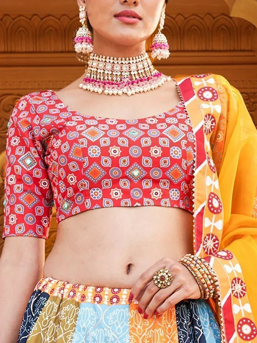 Red printed blouse with colorful lehenga, ethnic jewelry, and dupatta for Indian festive wear