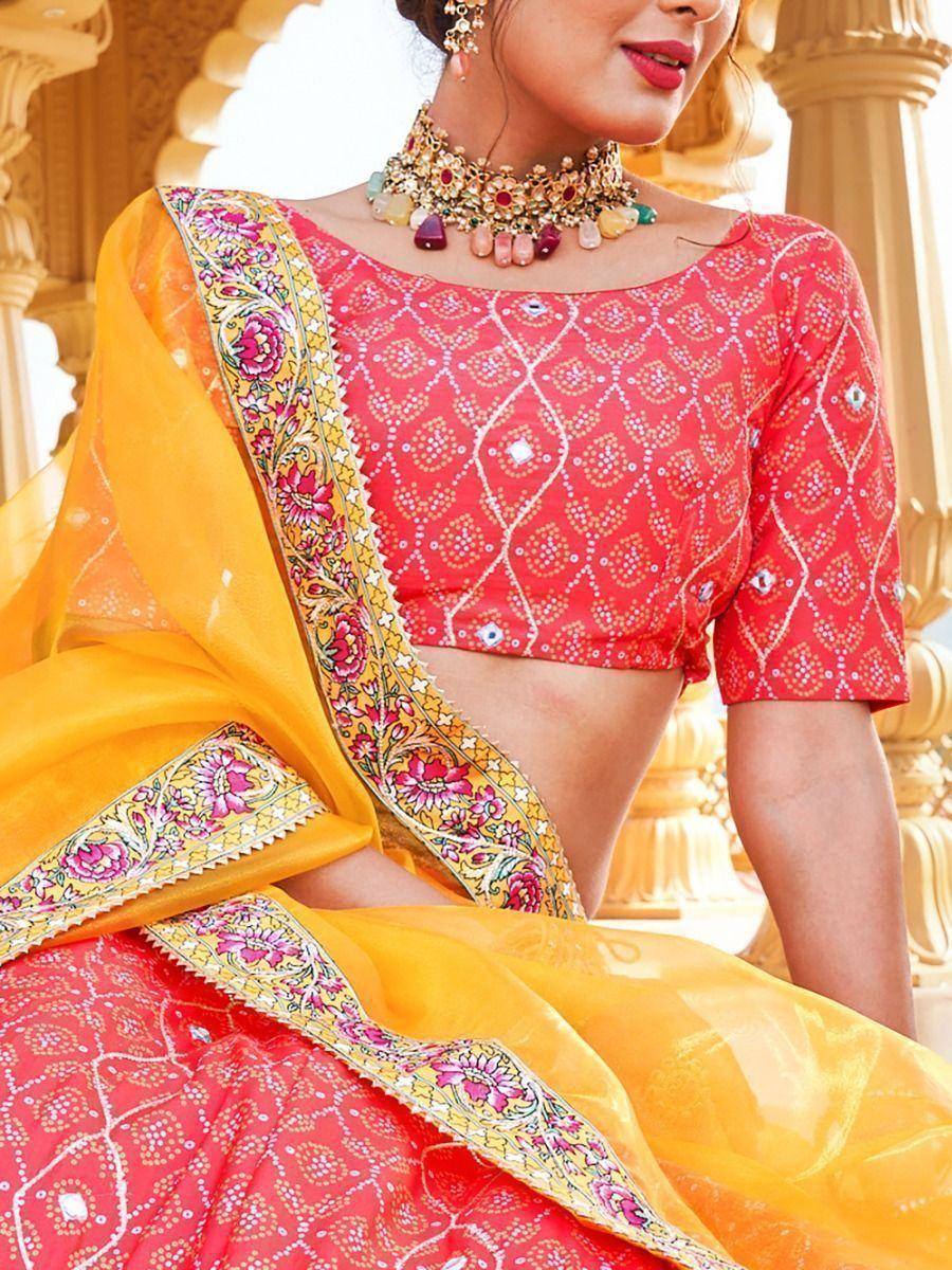 Red and yellow embroidered lehenga choli with floral dupatta, perfect for Indian ethnic wear occasions