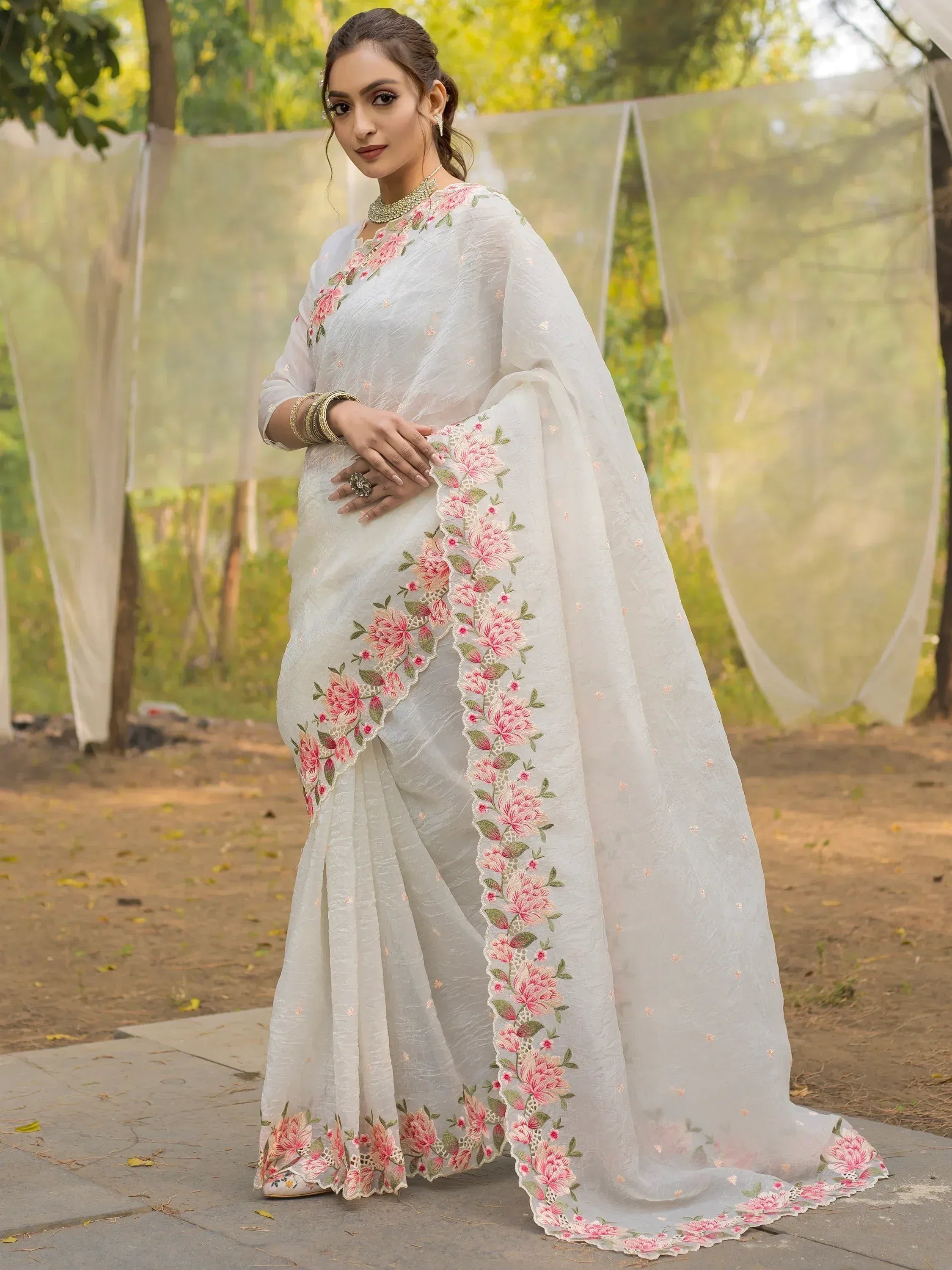 White floral embroidered saree with pink roses, perfect for Indian ethnic occasions and weddings.
