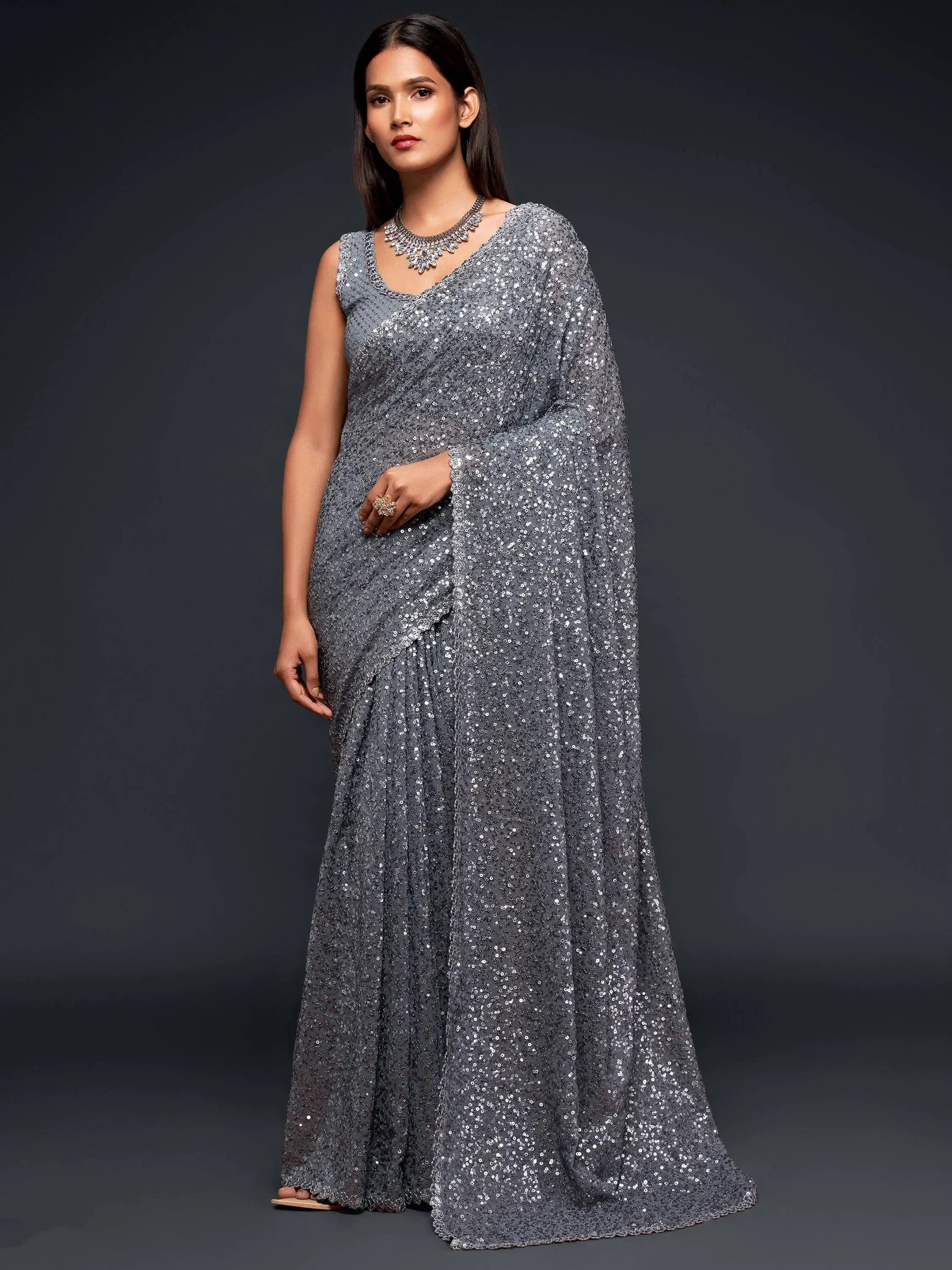 Grey sequin saree with sleeveless blouse, perfect for Indian ethnic wear events