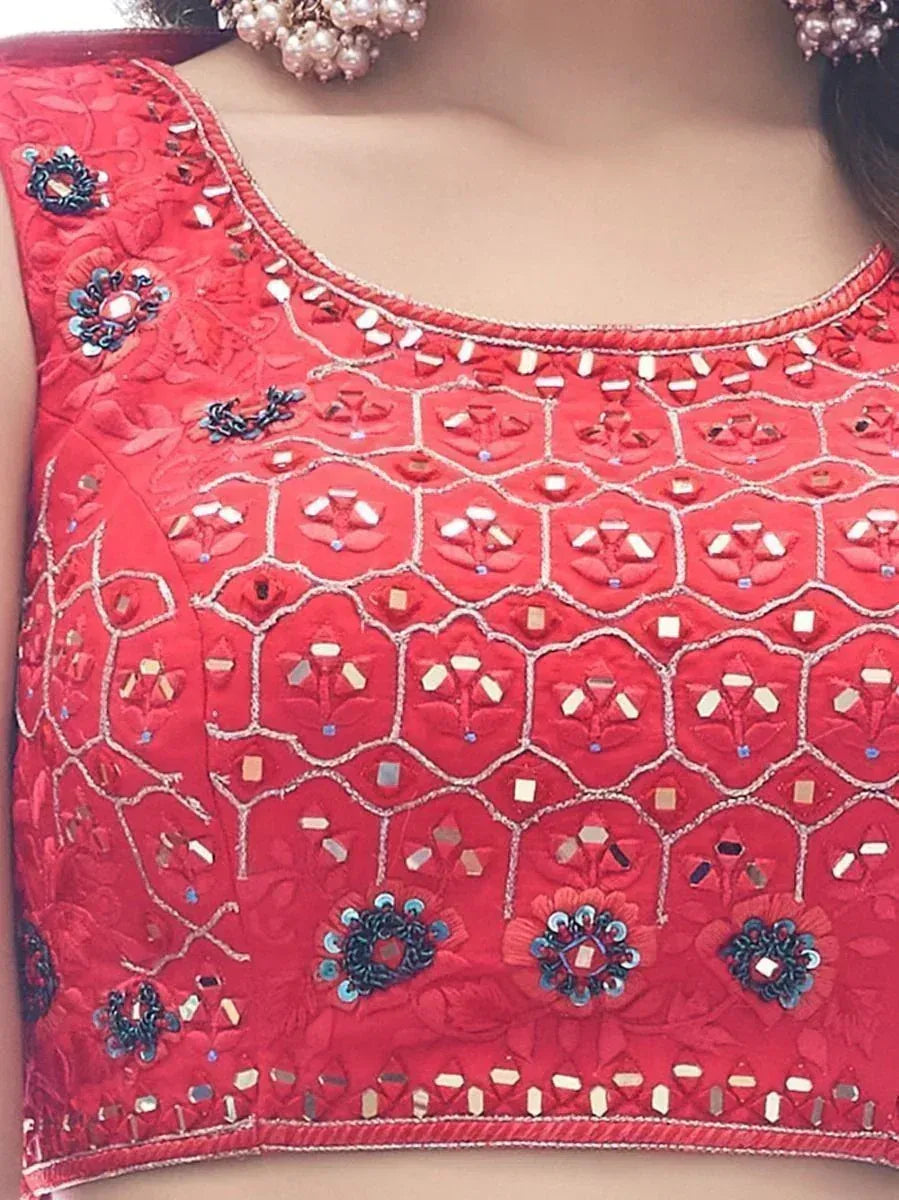 Red embroidered blouse with mirror work and floral motifs, perfect for Indian ethnic wear