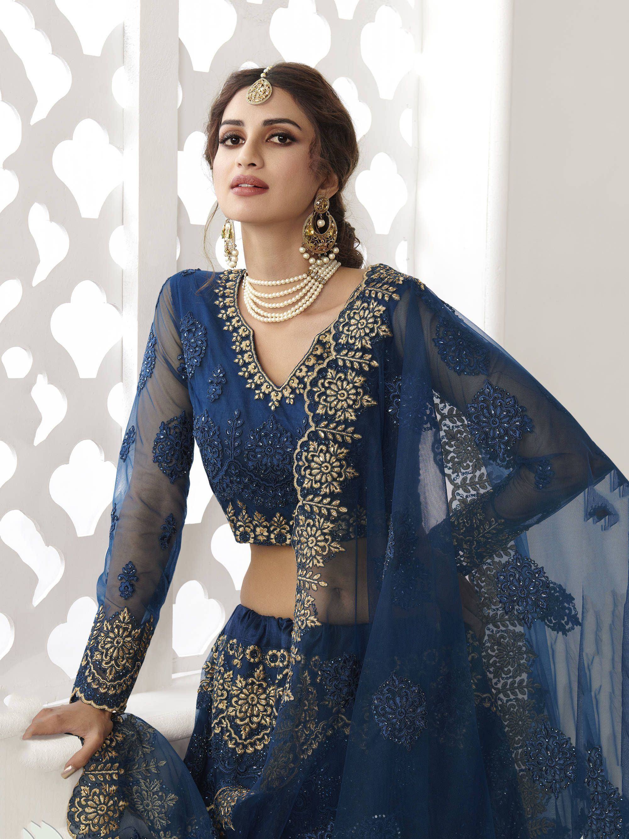 Navy blue embroidered lehenga choli with gold detailing, sheer sleeves, and matching dupatta for Indian ethnic wear