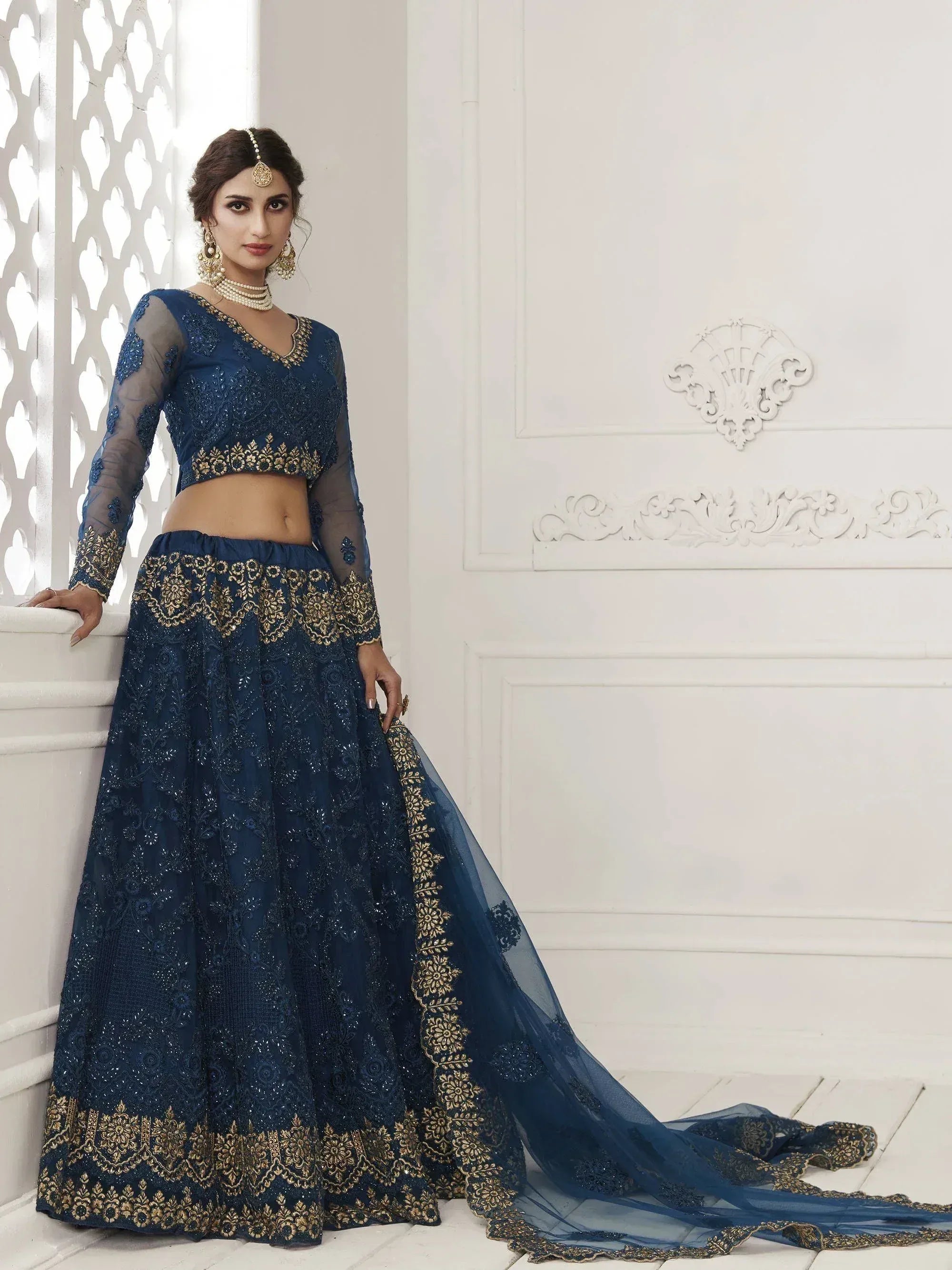Navy blue designer lehenga choli with gold embroidery, sheer sleeves, and dupatta for Indian ethnic wear