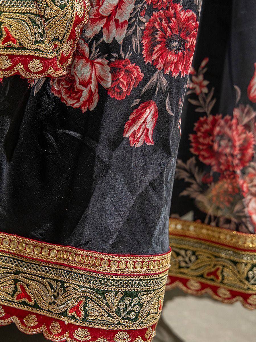 Black velvet ethnic gown with red floral print and gold embroidery detail