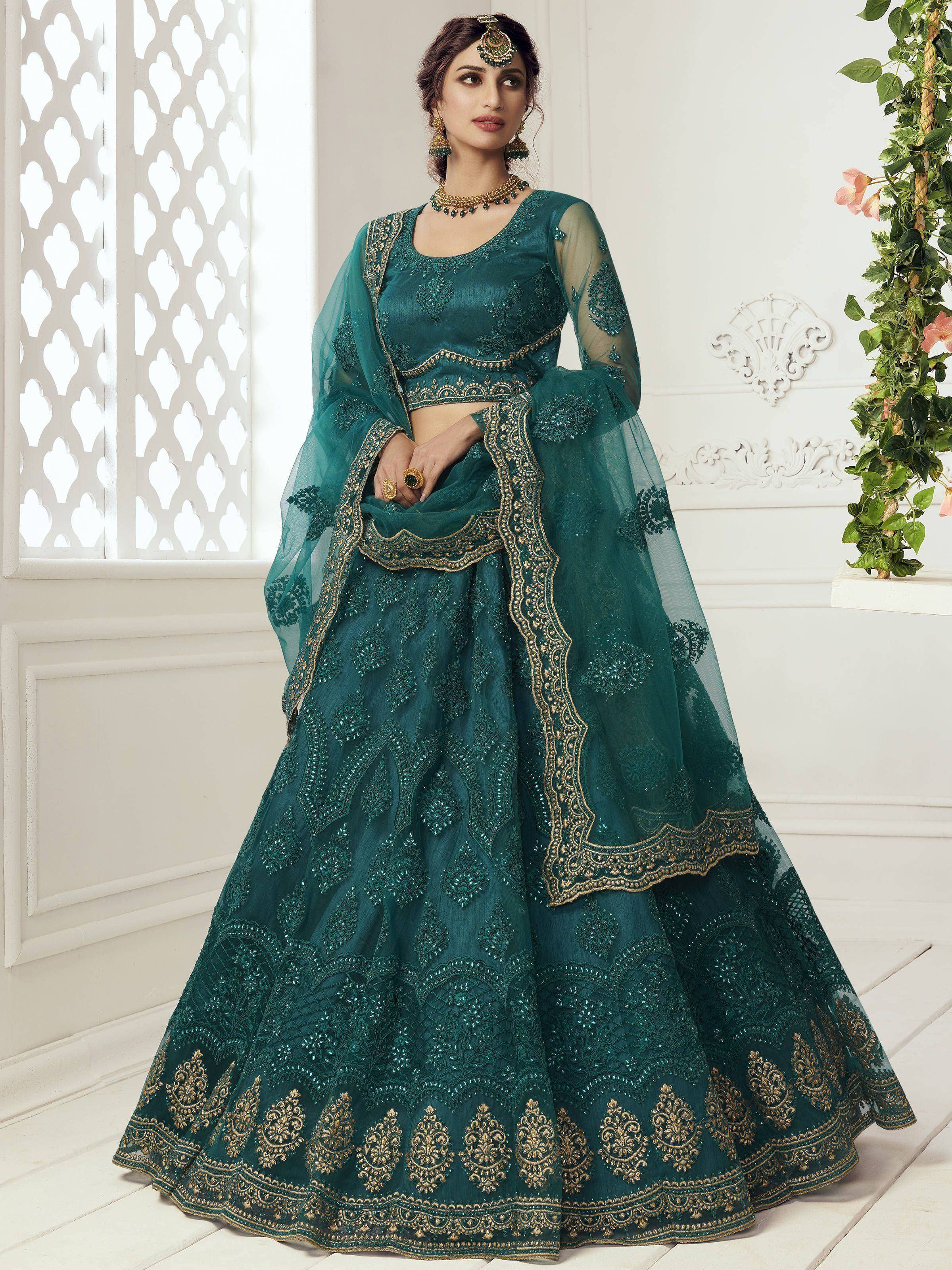 Emerald green designer lehenga choli with gold embroidery, perfect for Indian weddings and festive occasions.