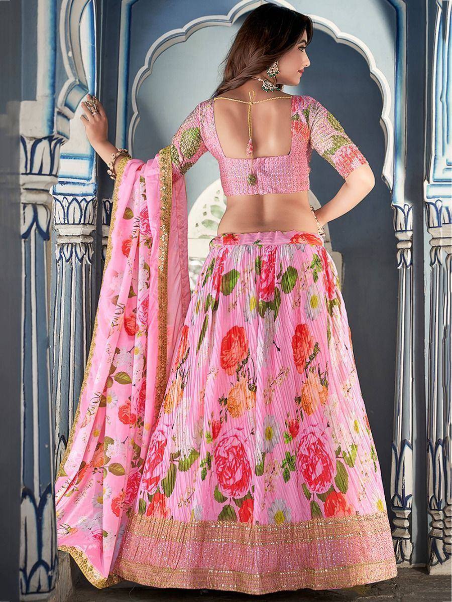 Pink floral lehenga choli with backless blouse and gold trim, ethnic Indian wear
