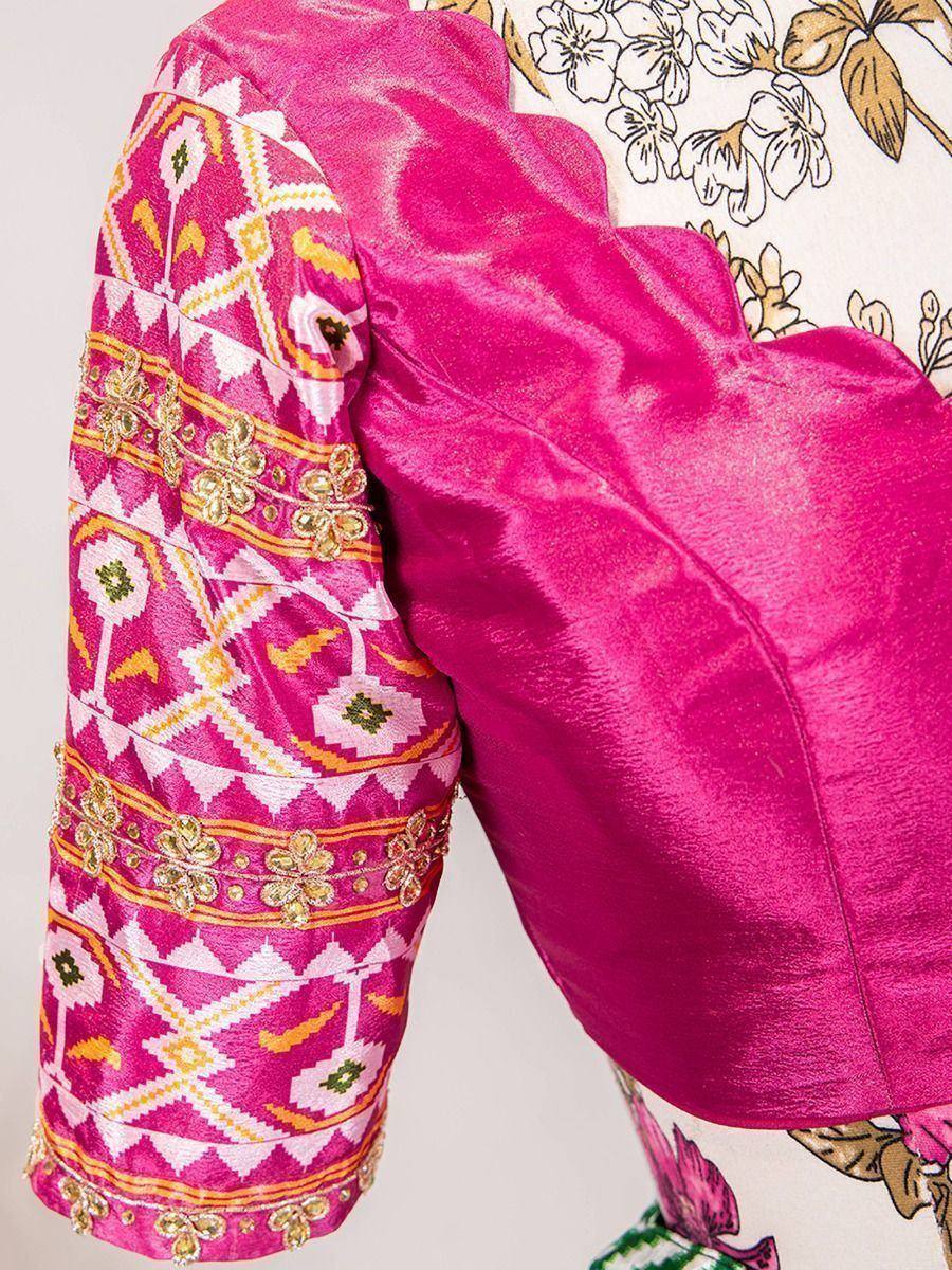 Pink ethnic blouse with geometric embroidery and gold detailing, perfect for designer lehenga choli sets