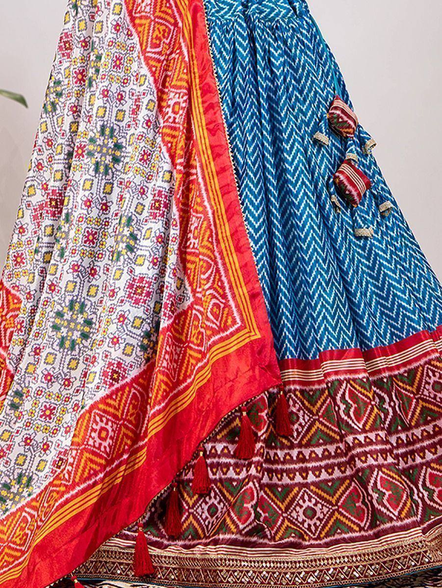 Blue and white printed lehenga with red border and floral dupatta, ethnic Indian wear