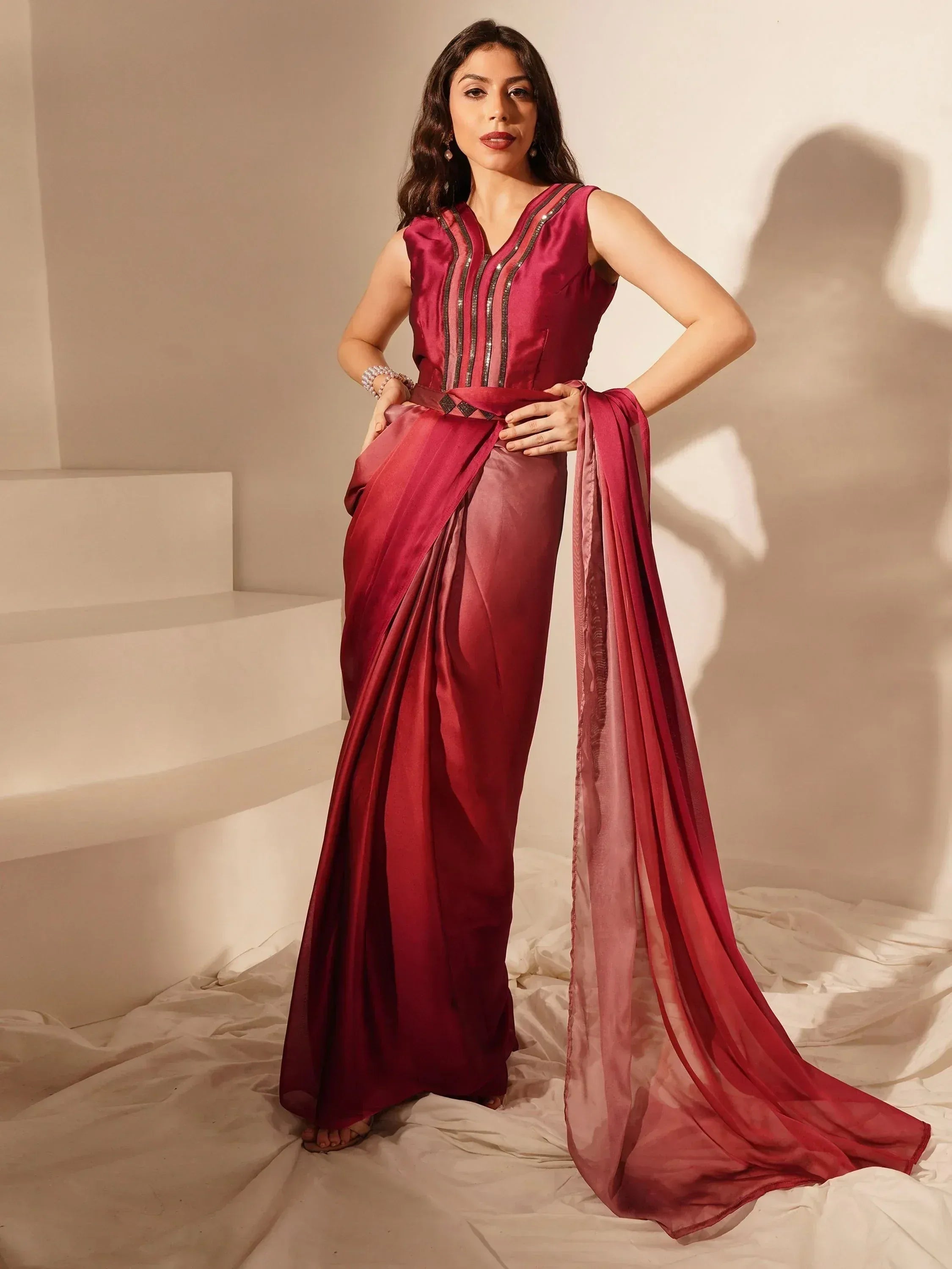 Burgundy ethnic gown with sequin detailing, perfect for Indian weddings and festive occasions.