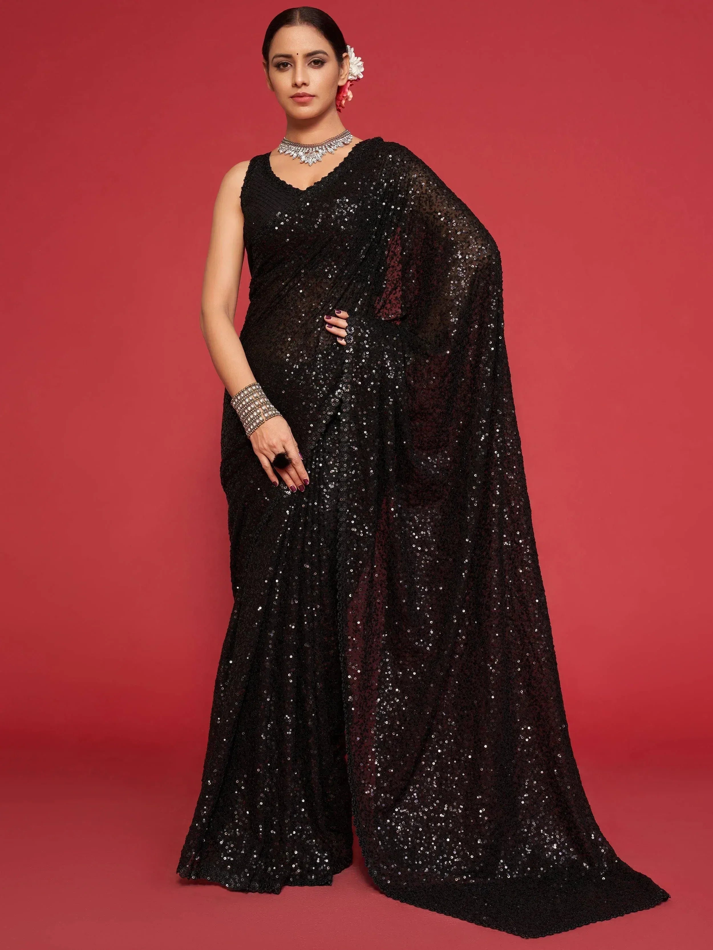 Black sequin saree with sleeveless blouse, perfect for Indian ethnic wear events