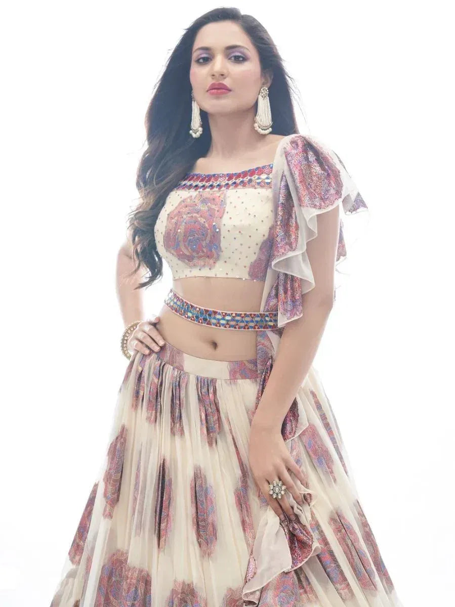 Elegant Indian lehenga choli with floral print, ruffled sleeves, and embellished belt for festive occasions